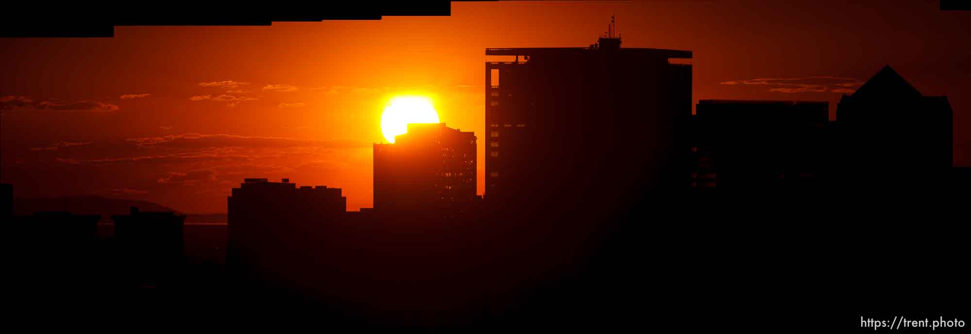 Trent Nelson  |  The Salt Lake Tribune
The sun sets over a smoky Salt Lake City skyline Sunday August 11, 2013.