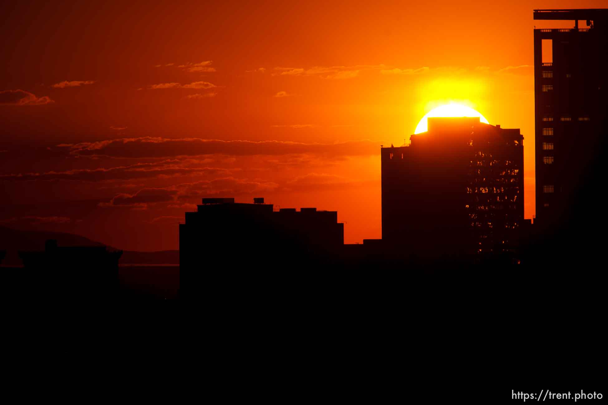 Trent Nelson  |  The Salt Lake Tribune
The sun sets over a smoky Salt Lake City skyline Sunday August 11, 2013.