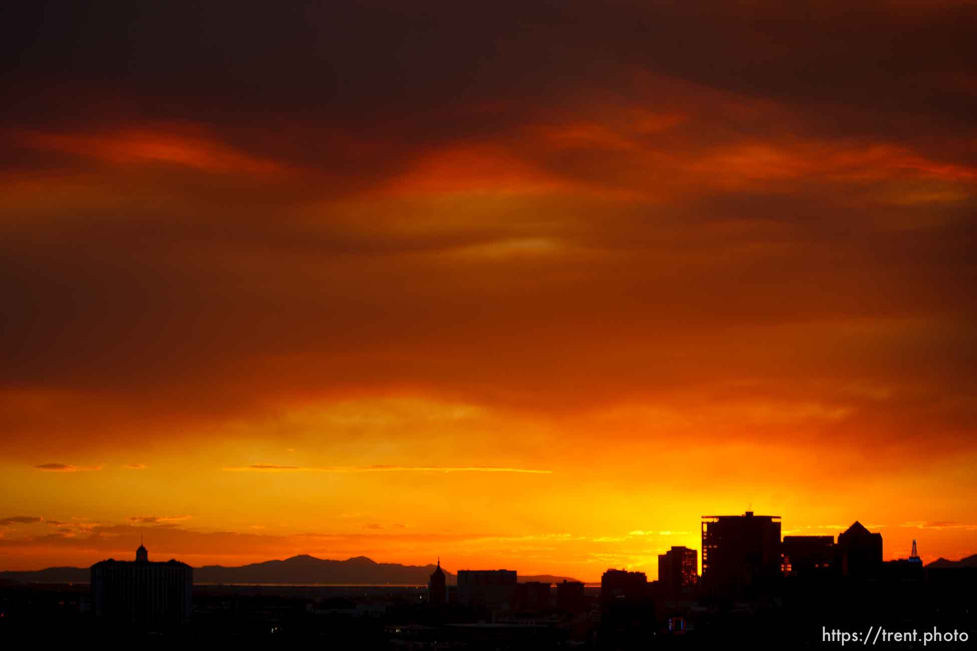 Trent Nelson  |  The Salt Lake Tribune
The sun sets over a smoky Salt Lake City skyline Sunday August 11, 2013.