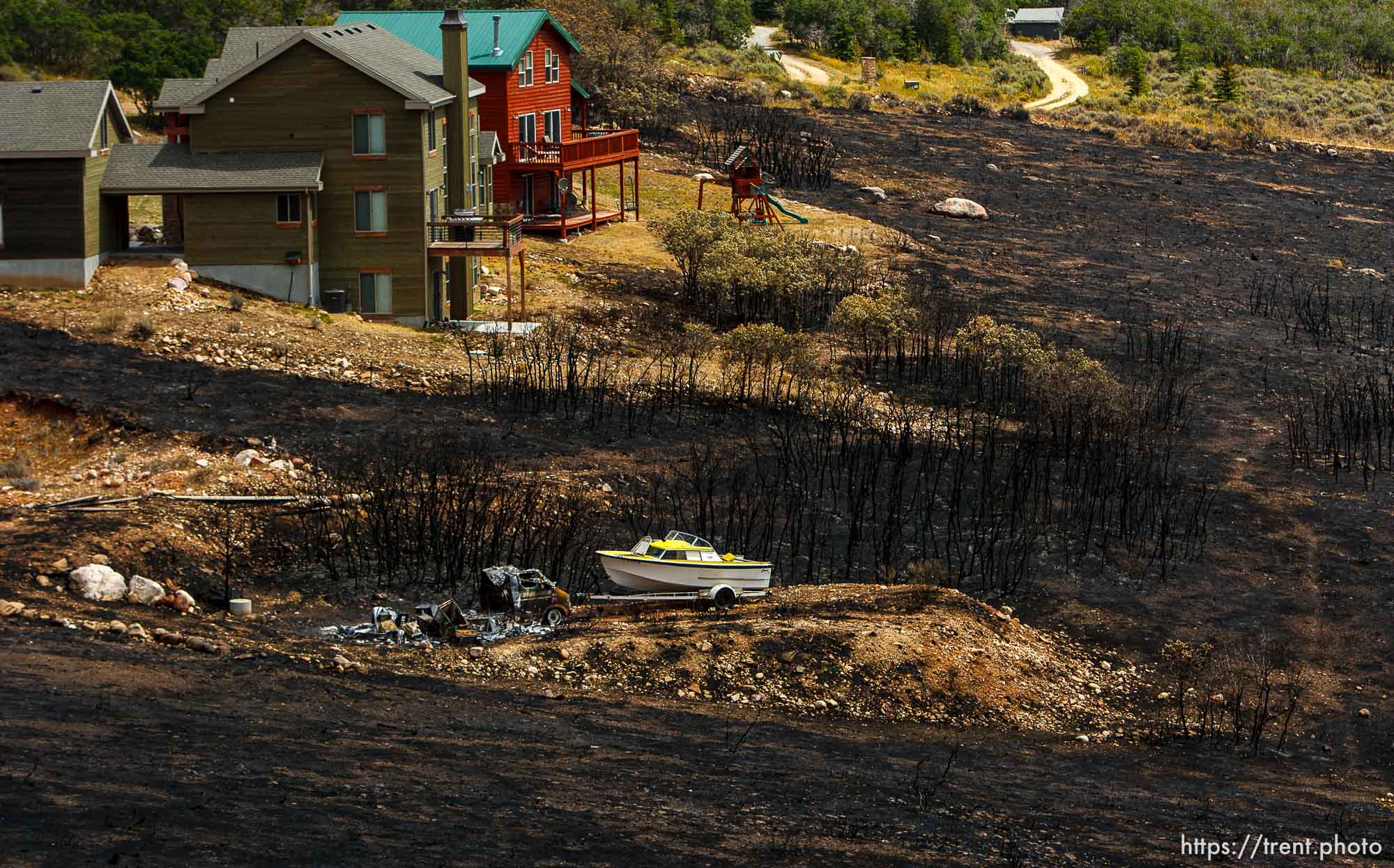 Trent Nelson  |  The Salt Lake Tribune
Homes spared from the fire in the Lake Rockport Estates, Thursday August 22, 2013. A Utah program requires new construction to reduce brush and trees around houses. This fuels mitigation strategy creates a defensible space so that wildfires have a decreased chance of burning structures.