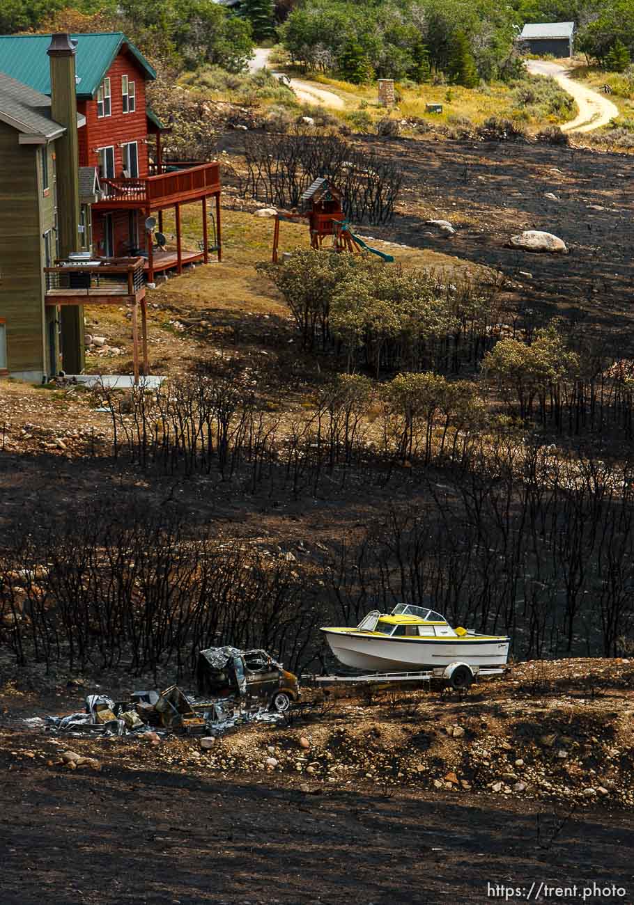 Trent Nelson  |  The Salt Lake Tribune
Homes spared from the fire in the Lake Rockport Estates, Thursday August 22, 2013. A Utah program requires new construction to reduce brush and trees around houses. This fuels mitigation strategy creates a defensible space so that wildfires have a decreased chance of burning structures.