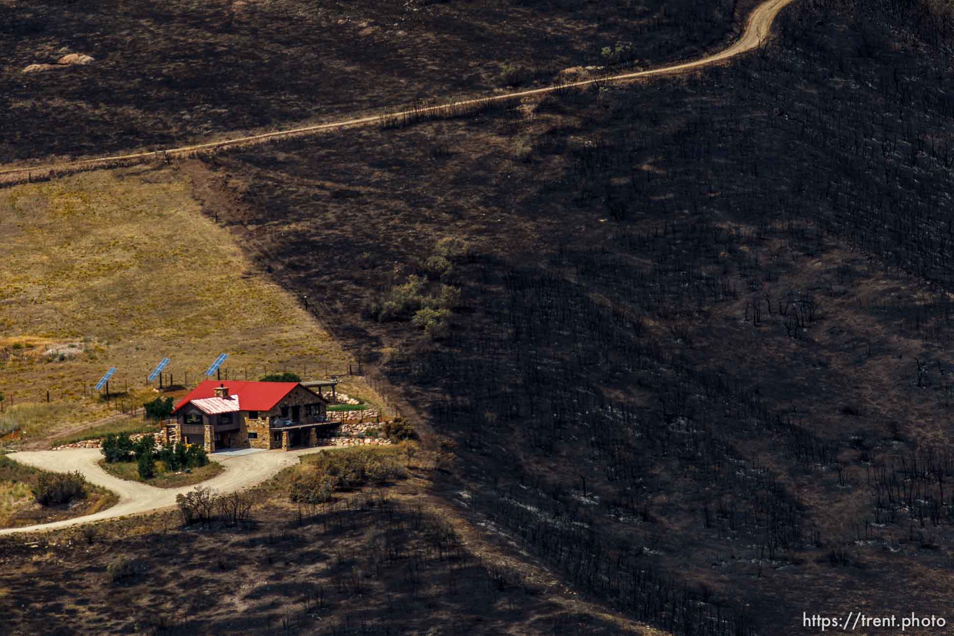 Trent Nelson  |  The Salt Lake Tribune
A home spared from the fire in the Lake Rockport Estates, Thursday August 22, 2013. A Utah program requires new construction to reduce brush and trees around houses. This fuels mitigation strategy creates a defensible space so that wildfires have a decreased chance of burning structures.