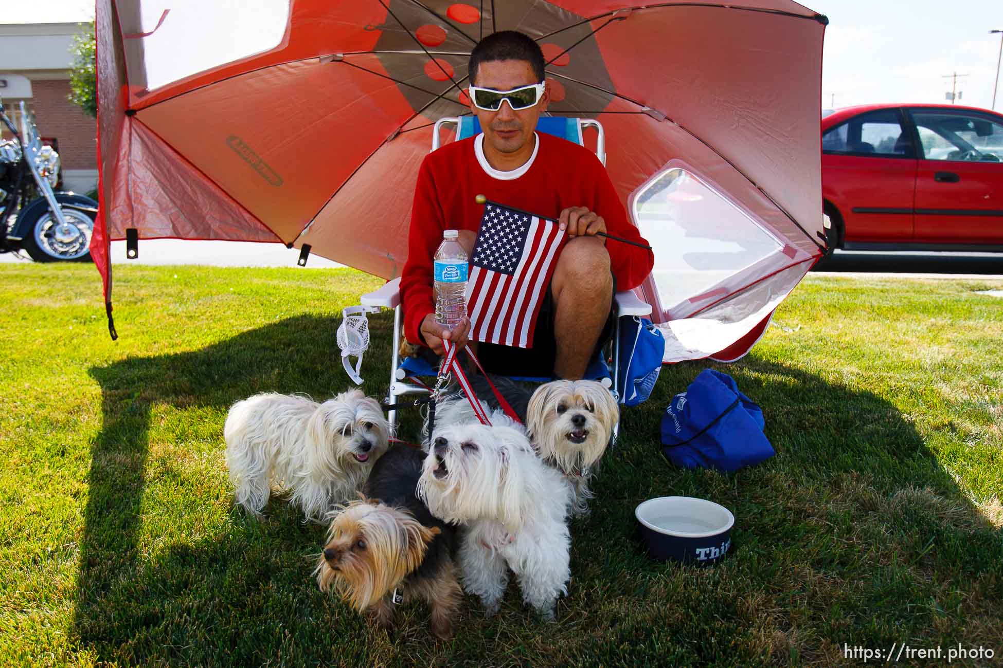 Trent Nelson  |  The Salt Lake Tribune
Johnny Imperial with his four dogs. Flags fly as the funeral procession for Sgt. Derek Johnson, the Draper police officer who was shot to death on Sunday morning, passes through Draper Friday, September 6, 2013.