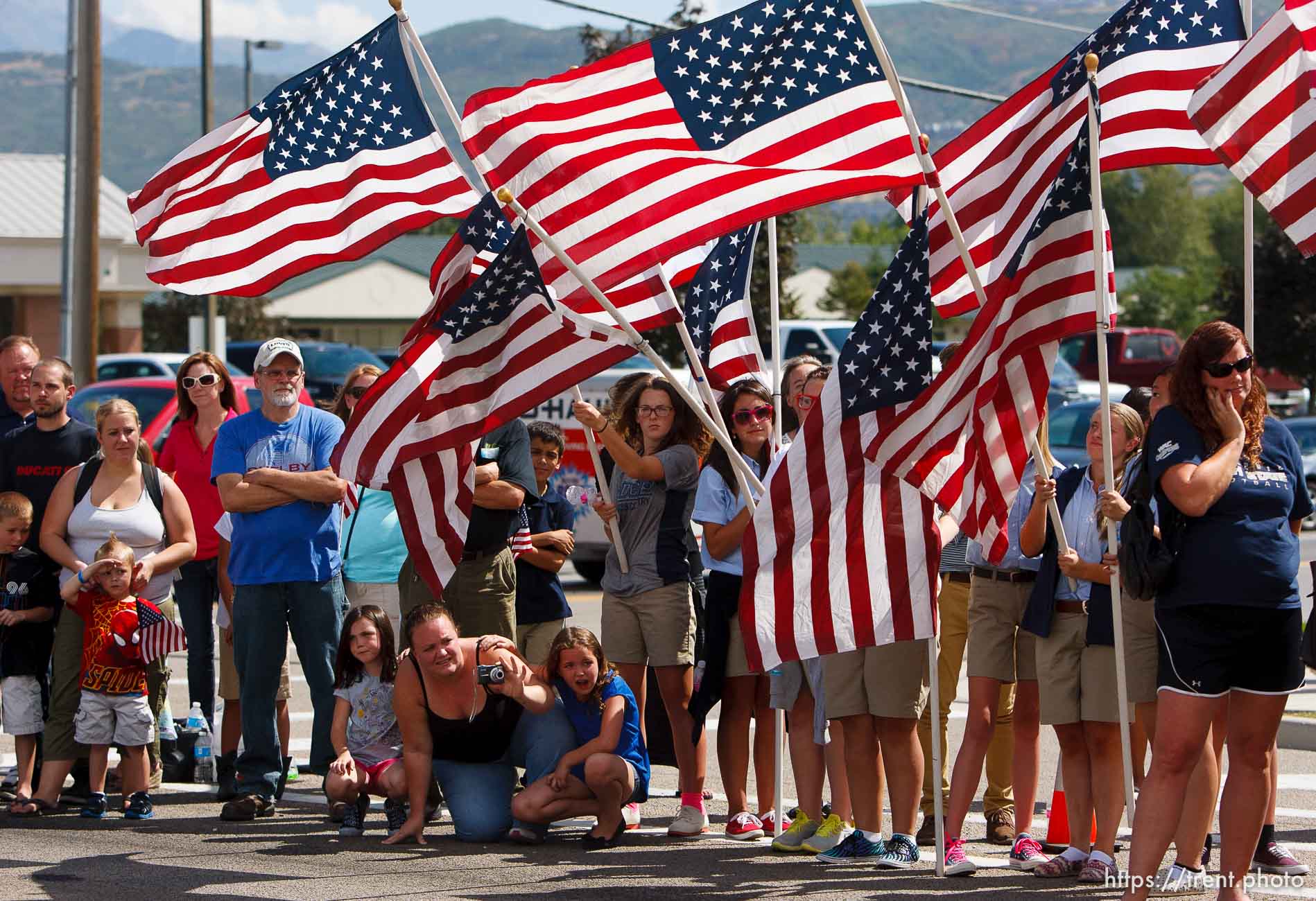 Trent Nelson  |  The Salt Lake Tribune
Flags fly as the funeral procession for Sgt. Derek Johnson, the Draper police officer who was shot to death on Sunday morning, passes through Draper Friday, September 6, 2013.