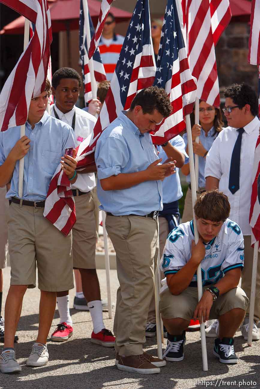 Trent Nelson  |  The Salt Lake Tribune
Some of the approximately 800 students from Juan Diego High School hold flags as the funeral procession for Sgt. Derek Johnson, the Draper police officer who was shot to death on Sunday morning, passes through Draper Friday, September 6, 2013.