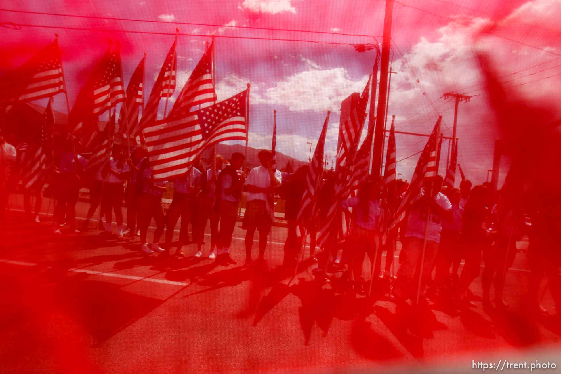 Trent Nelson  |  The Salt Lake Tribune
Flags fly as the funeral procession for Sgt. Derek Johnson, the Draper police officer who was shot to death on Sunday morning, passes through Draper Friday, September 6, 2013.