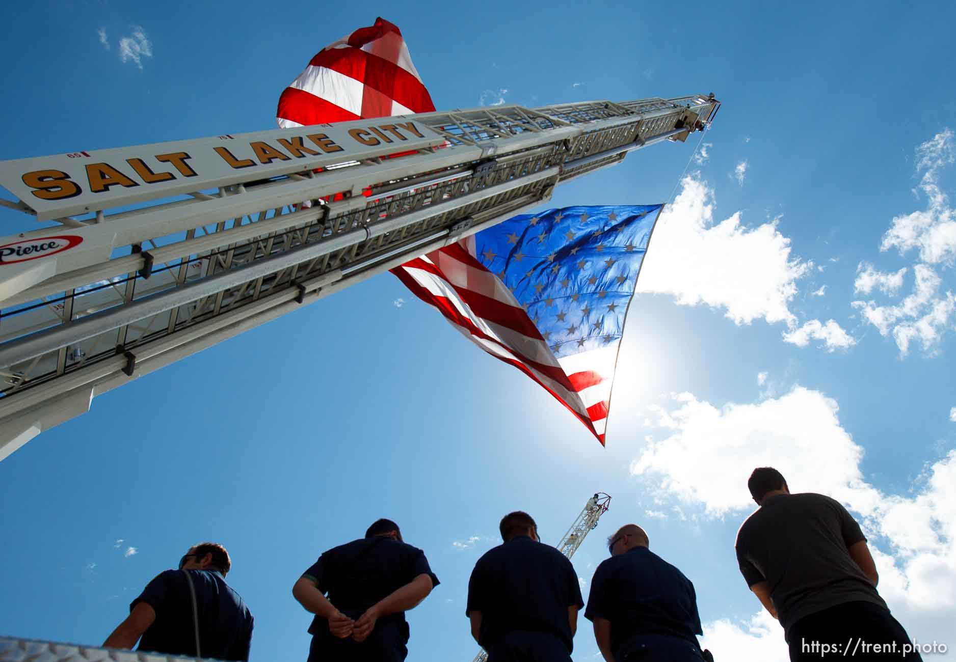 Trent Nelson  |  The Salt Lake Tribune
Flags fly as the funeral procession for Sgt. Derek Johnson, the Draper police officer who was shot to death on Sunday morning, passes through Draper Friday, September 6, 2013.