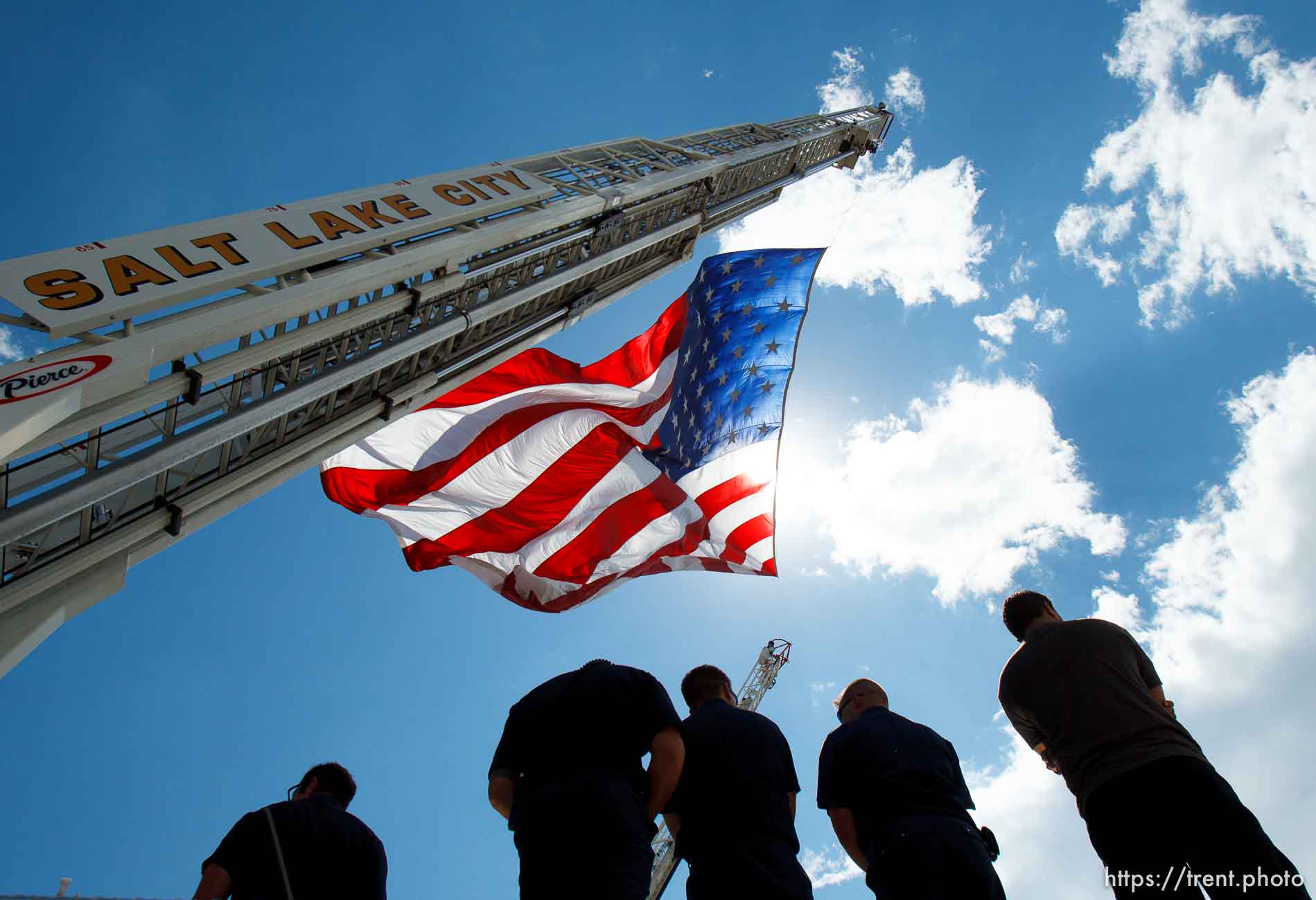 Trent Nelson  |  The Salt Lake Tribune
Flags fly as the funeral procession for Sgt. Derek Johnson, the Draper police officer who was shot to death on Sunday morning, passes through Draper Friday, September 6, 2013.