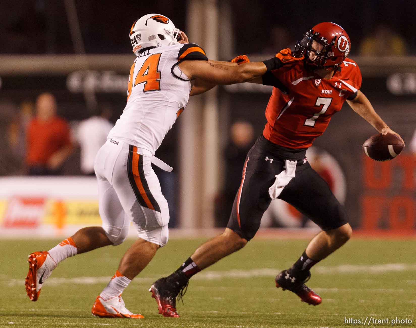 Trent Nelson  |  The Salt Lake Tribune
Oregon State Beavers defensive end Devon Kell (94) chases down Utah Utes quarterback Travis Wilson (7) as the University of Utah hosts Oregon State, college football at Rice Eccles Stadium Saturday, September 14, 2013 in Salt Lake City. Kell was called for a facemask penalty on the play.