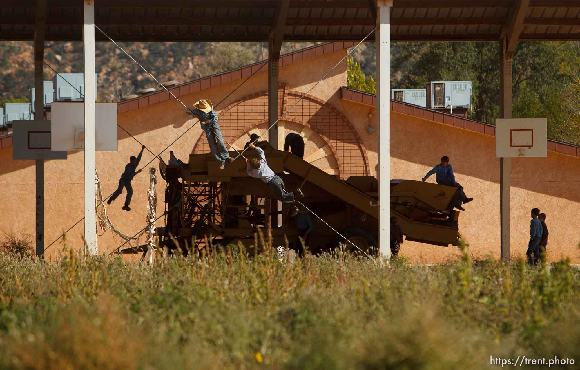 Trent Nelson  |  The Salt Lake Tribune
Boys playing on farm equipment/tractor, during school recess in Colorado City Tuesday, October 8, 2013.