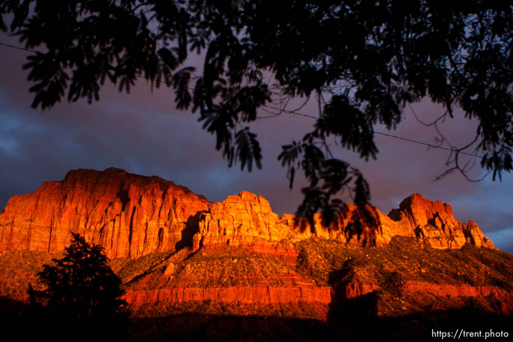 Trent Nelson  |  The Salt Lake Tribune
The sun sets on peaks overlooking Springdale, Thursday, October 10, 2013. The state and federal governments are working out the details of a deal to reopen Zion and the other national parks in Utah as the government shutdown continues.