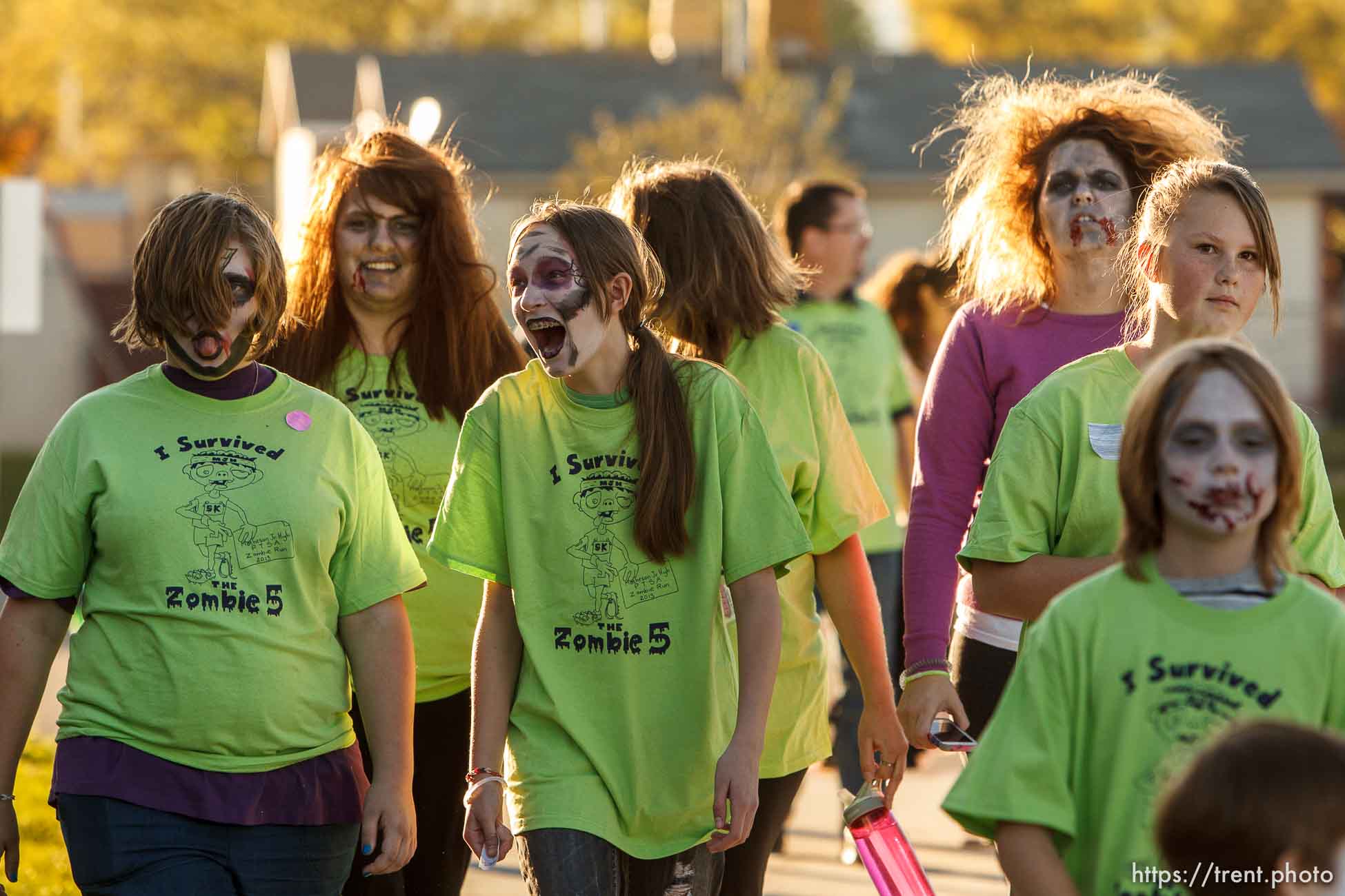 Trent Nelson  |  The Salt Lake Tribune
Students, community members, and faculty participate in a Zombie 5K run at Matheson Junior High School in Magna, Wednesday October 23, 2013. Participants register ran along a route near the school as humans or zombies to raise funds for the school.