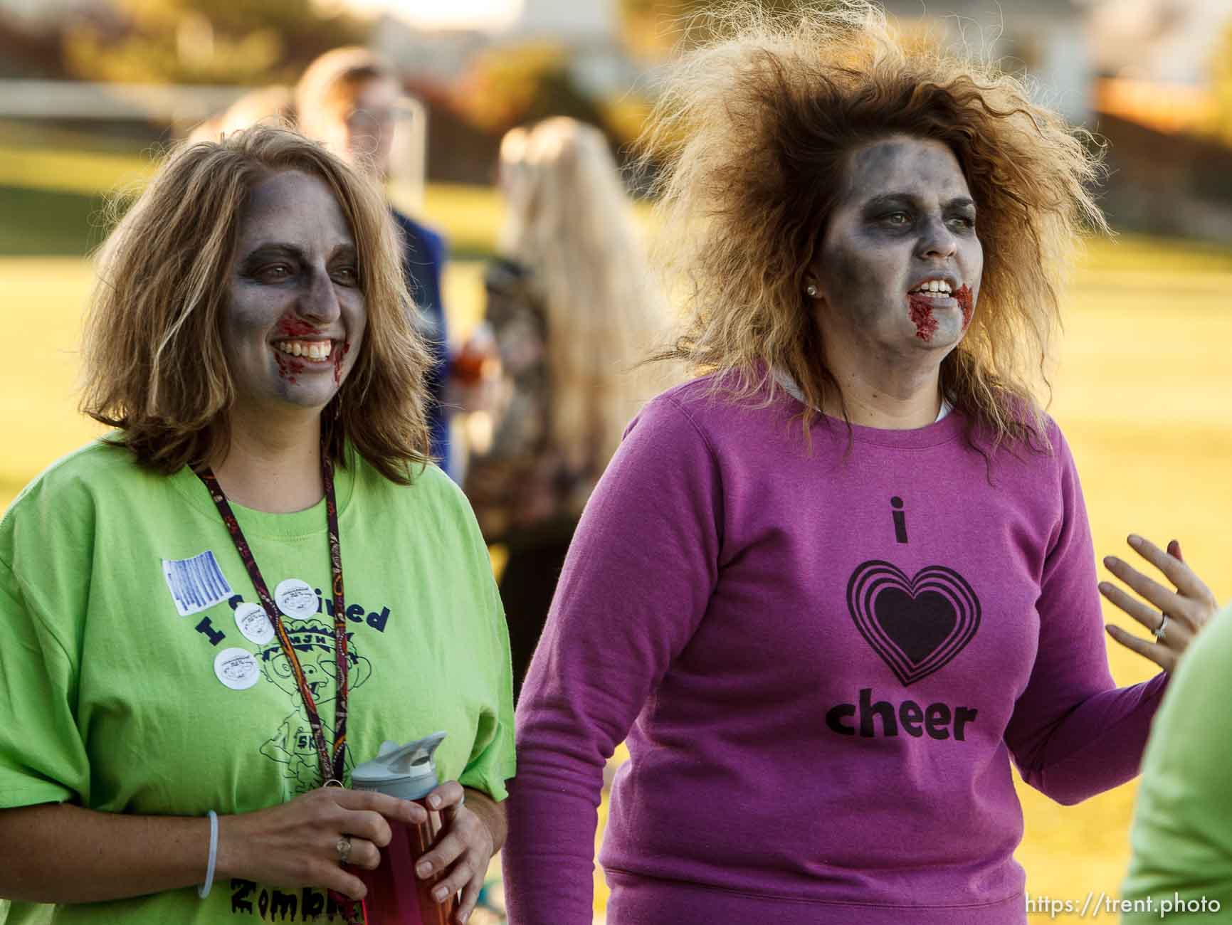 Trent Nelson  |  The Salt Lake Tribune
Katherine Bracero and Samantha Taggart, teachers at Matheson Junior High School in Magna, participate in a Zombie 5K run, Wednesday October 23, 2013. Participants register ran along a route near the school as humans or zombies to raise funds for the school.