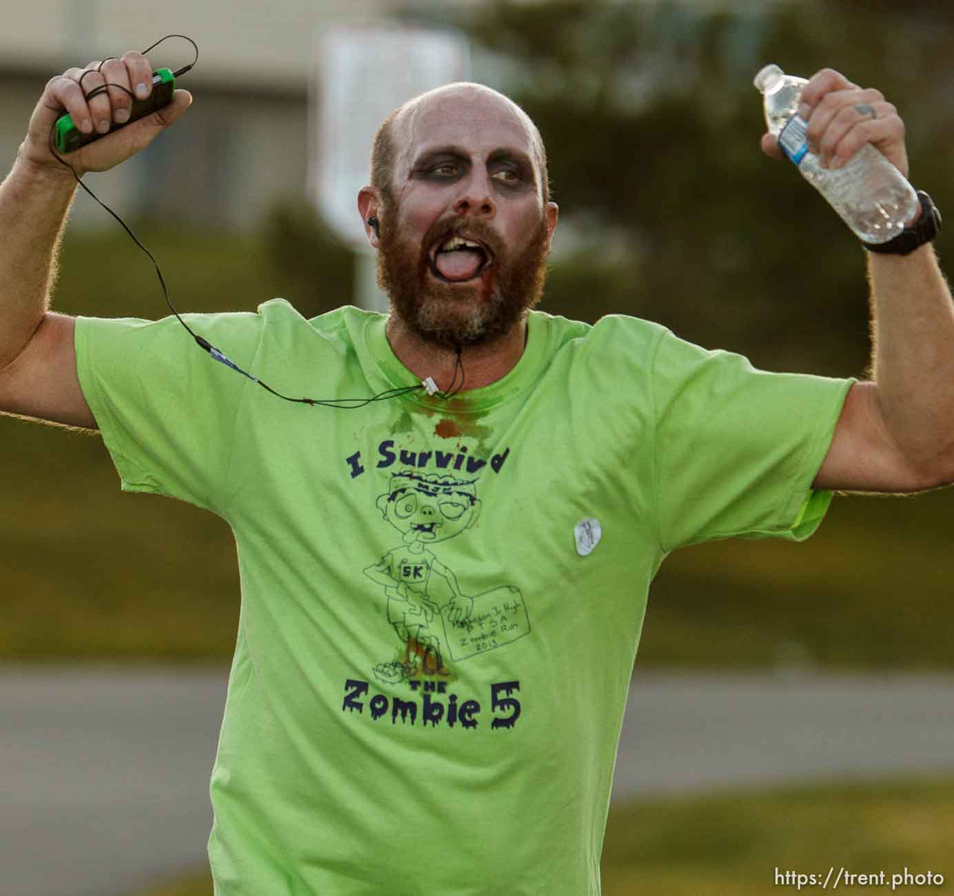 Trent Nelson  |  The Salt Lake Tribune
Scott Garreaud is the first zombie to cross the finish line in a Zombie 5K run at Matheson Junior High School in Magna, Wednesday October 23, 2013. Participants register ran along a route near the school as humans or zombies to raise funds for the school.