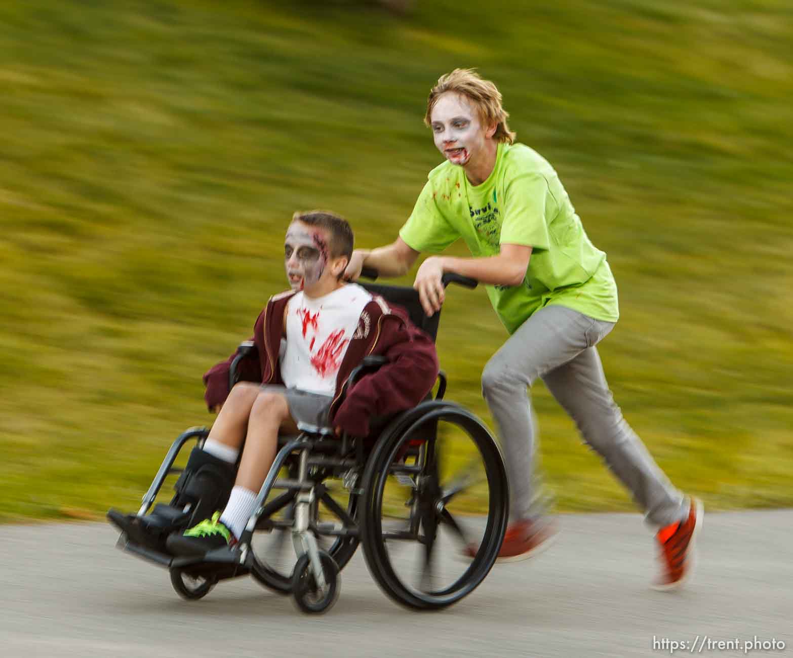 Trent Nelson  |  The Salt Lake Tribune
Keeton Collins and Derek O'Donnell participate in a Zombie 5K run at Matheson Junior High School in Magna, Wednesday October 23, 2013. Participants register ran along a route near the school as humans or zombies to raise funds for the school.