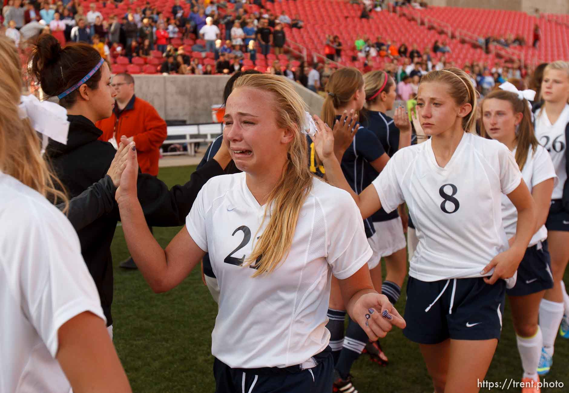 Trent Nelson  |  The Salt Lake Tribune
Waterford players tearfully congratulate Summit players after the game Summit Academy takes the 2A high school girls' soccer state championship game at Rio Tinto Stadium in Sandy, Saturday October 26, 2013. Caroline Coats is #21.