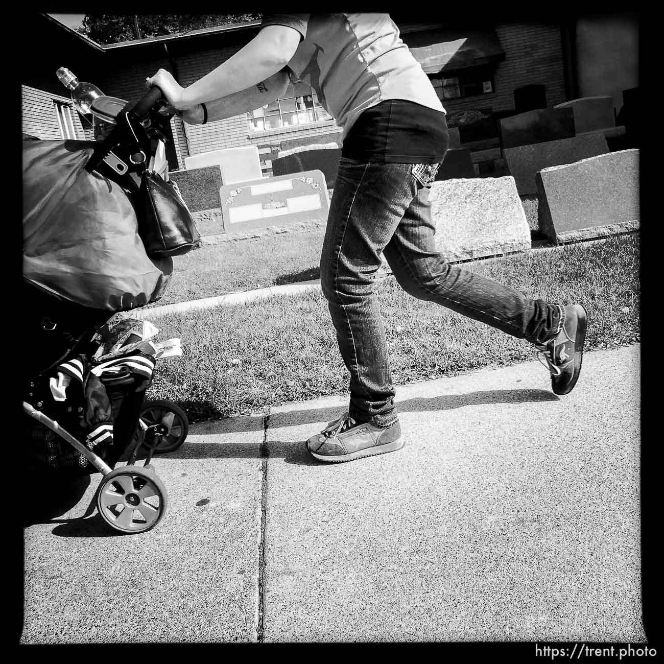 baby being walked past gravestones along State Street, Monday October 21, 2013.