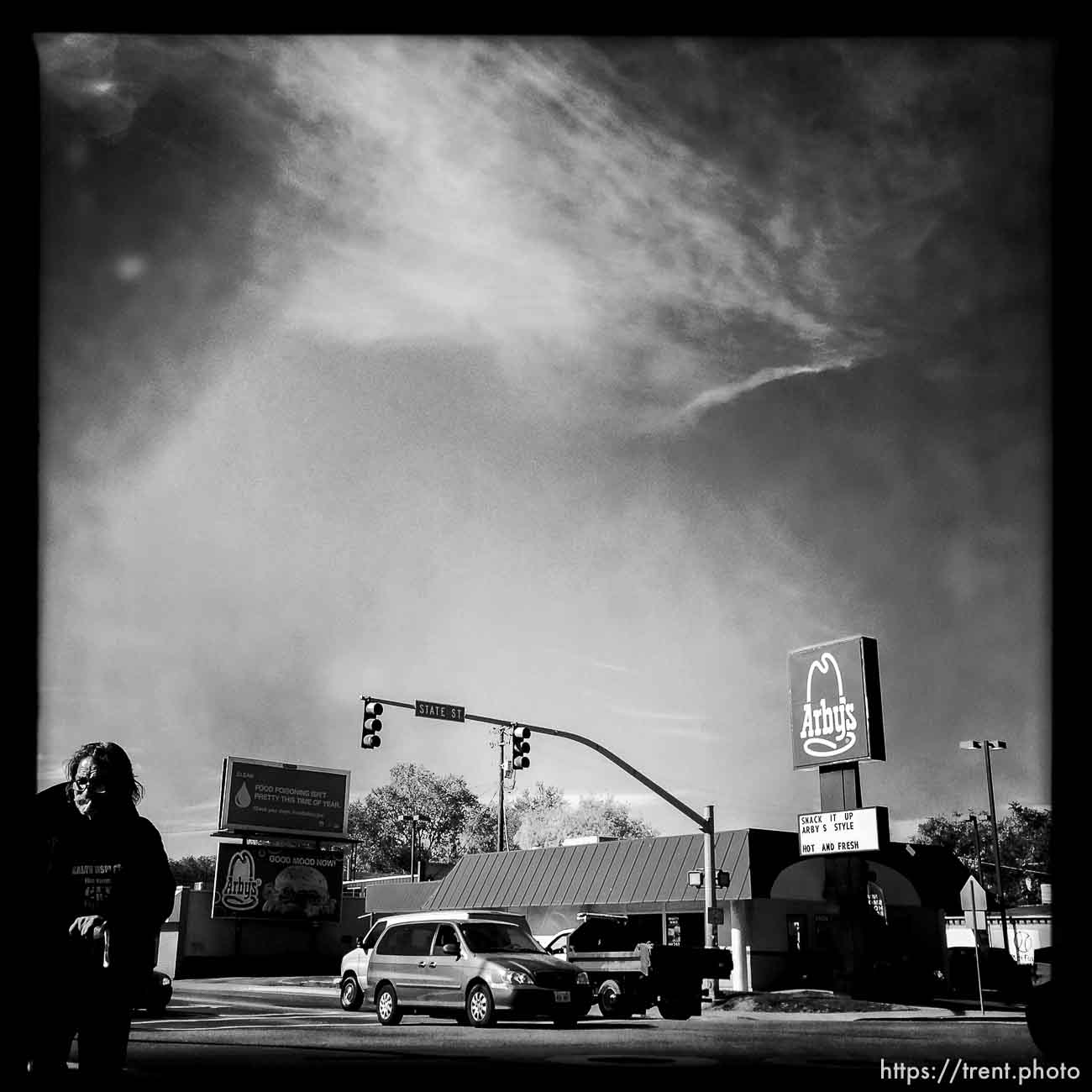 guy on bike with cigarette along State Street, Monday October 21, 2013. Arby's