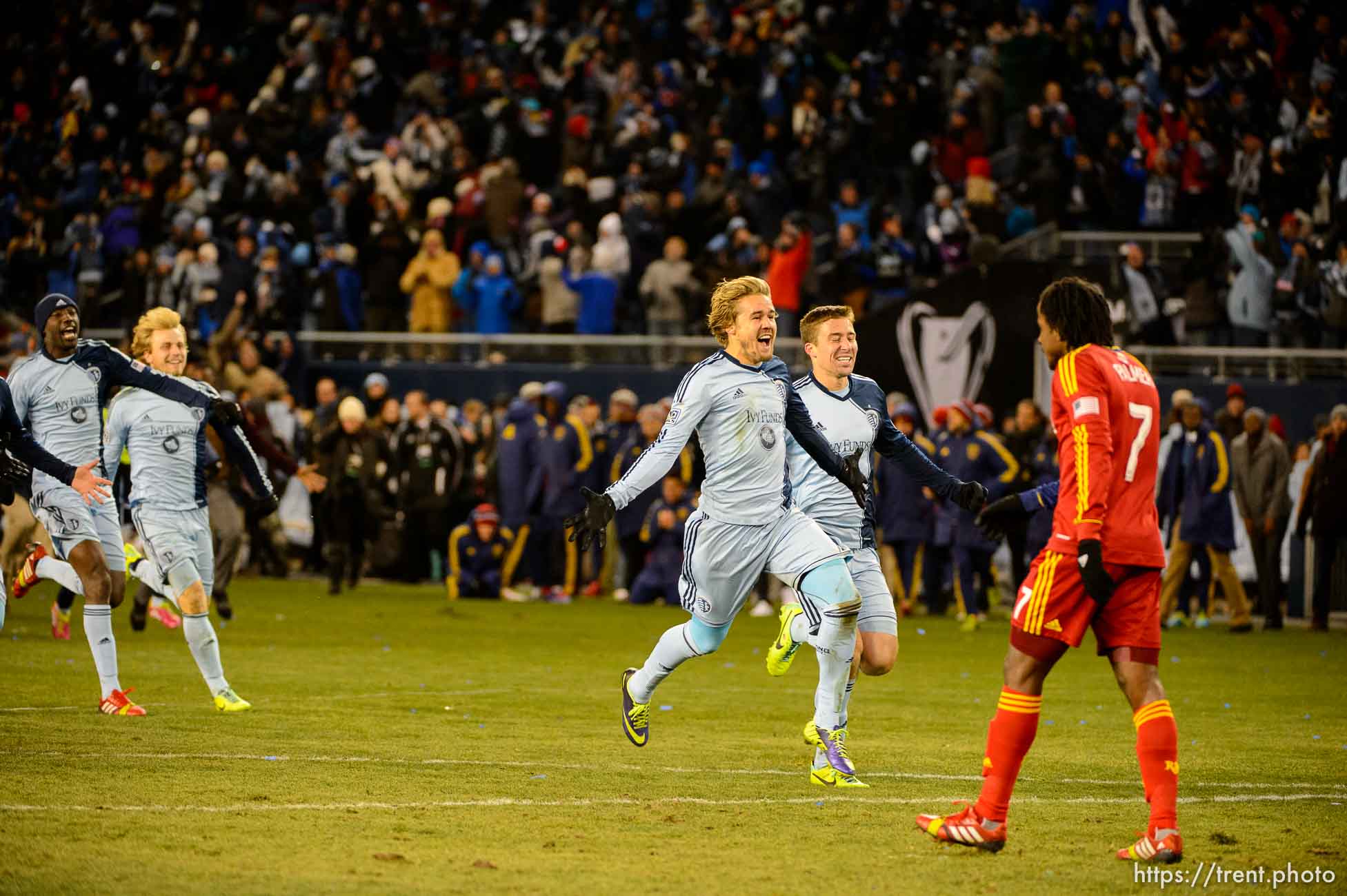 Trent Nelson  |  The Salt Lake Tribune
Sporting KC players celebrate, running past Real Salt Lake's Lovel Palmer (7) as Real Salt Lake faces Sporting KC in the MLS Cup Final at Sporting Park in Kansas City, Saturday December 7, 2013.