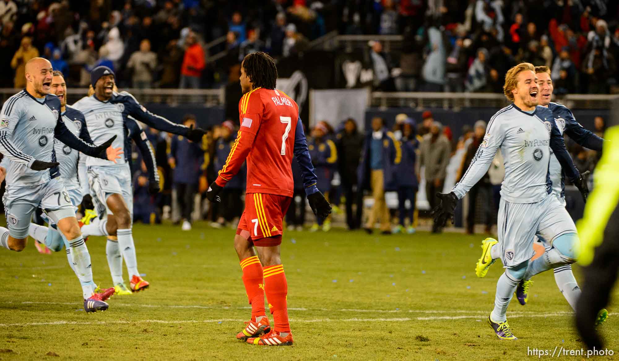 Trent Nelson  |  The Salt Lake Tribune
Sporting KC players celebrate, running past Real Salt Lake's Lovel Palmer (7) as Real Salt Lake faces Sporting KC in the MLS Cup Final at Sporting Park in Kansas City, Saturday December 7, 2013.