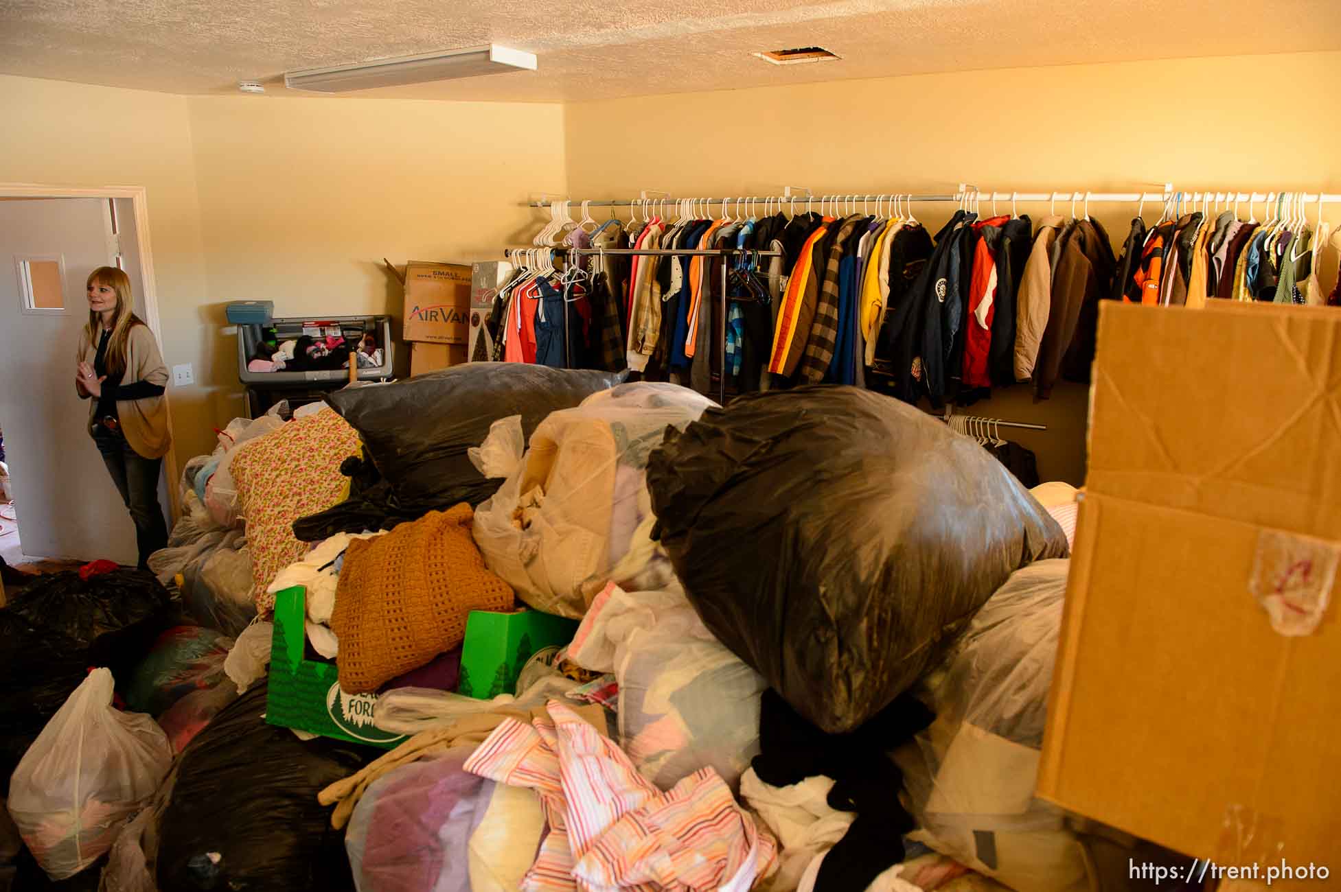 Trent Nelson  |  The Salt Lake Tribune
Ruth Olson looks over donations for a planned thrift store at the community center in Colorado City that is being set up by Holding Out Hope, Saturday December 14, 2013.