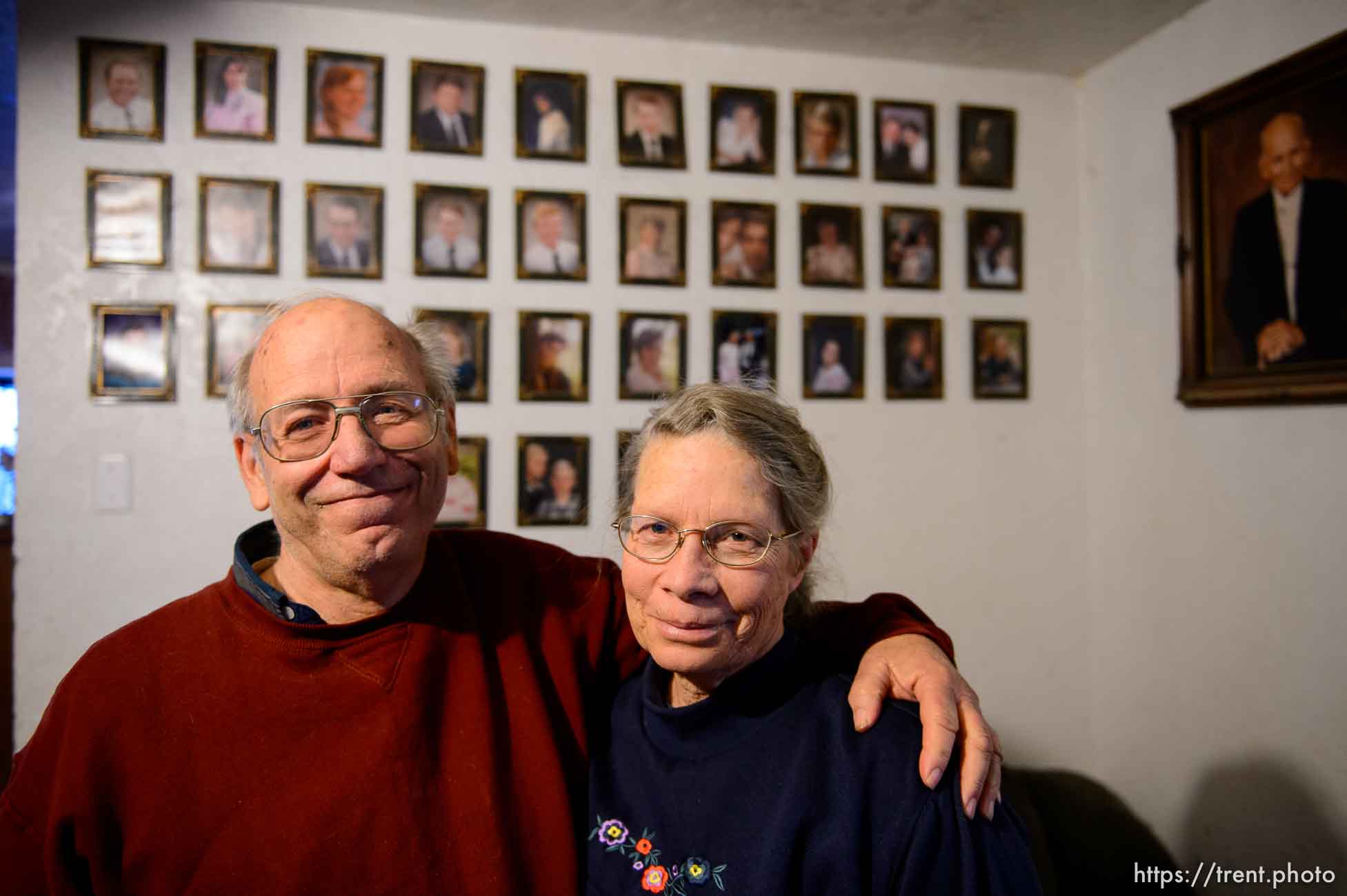 Trent Nelson  |  The Salt Lake Tribune
Marvin and Charlette Wyler in their Hildale home, Saturday December 14, 2013. On the wall behind them are portraits of Marvin's 34 children, and polygamist leader Leroy Johnson.