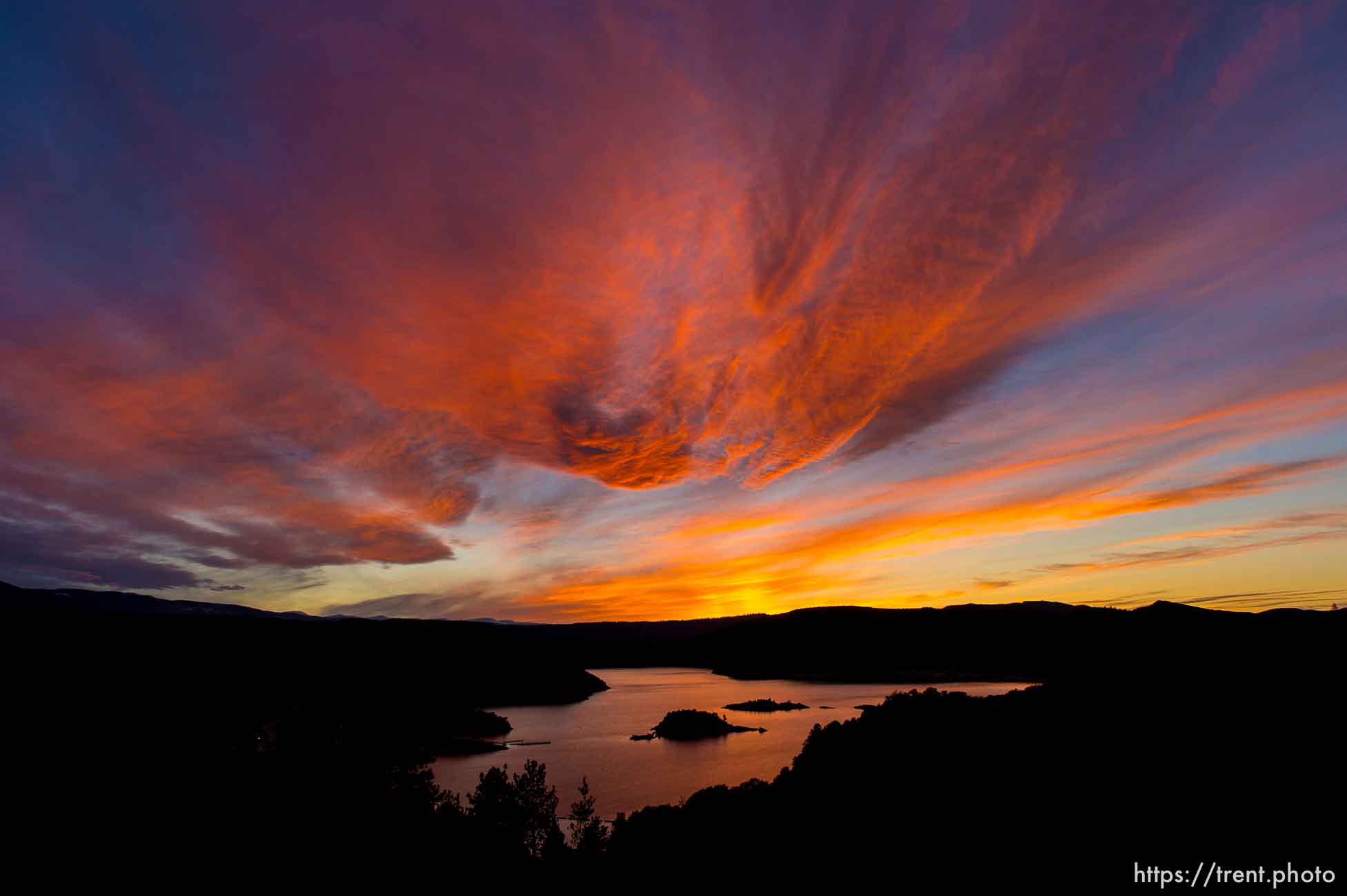 The sun sets over the Flaming Gorge Reservoir, Thursday, March 20, 2014.