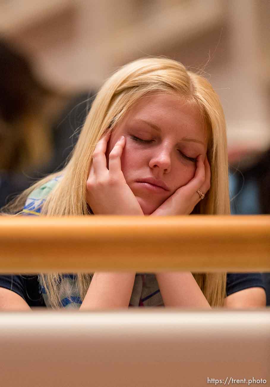 Trent Nelson  |  The Salt Lake Tribune
A young woman rests before the start of the LDS General Women's Meeting in Salt Lake City, Saturday March 29, 2014. For the first time ever for Young Women and Relief Society and Primary will meet altogether, with every LDS female 8 and up invited.