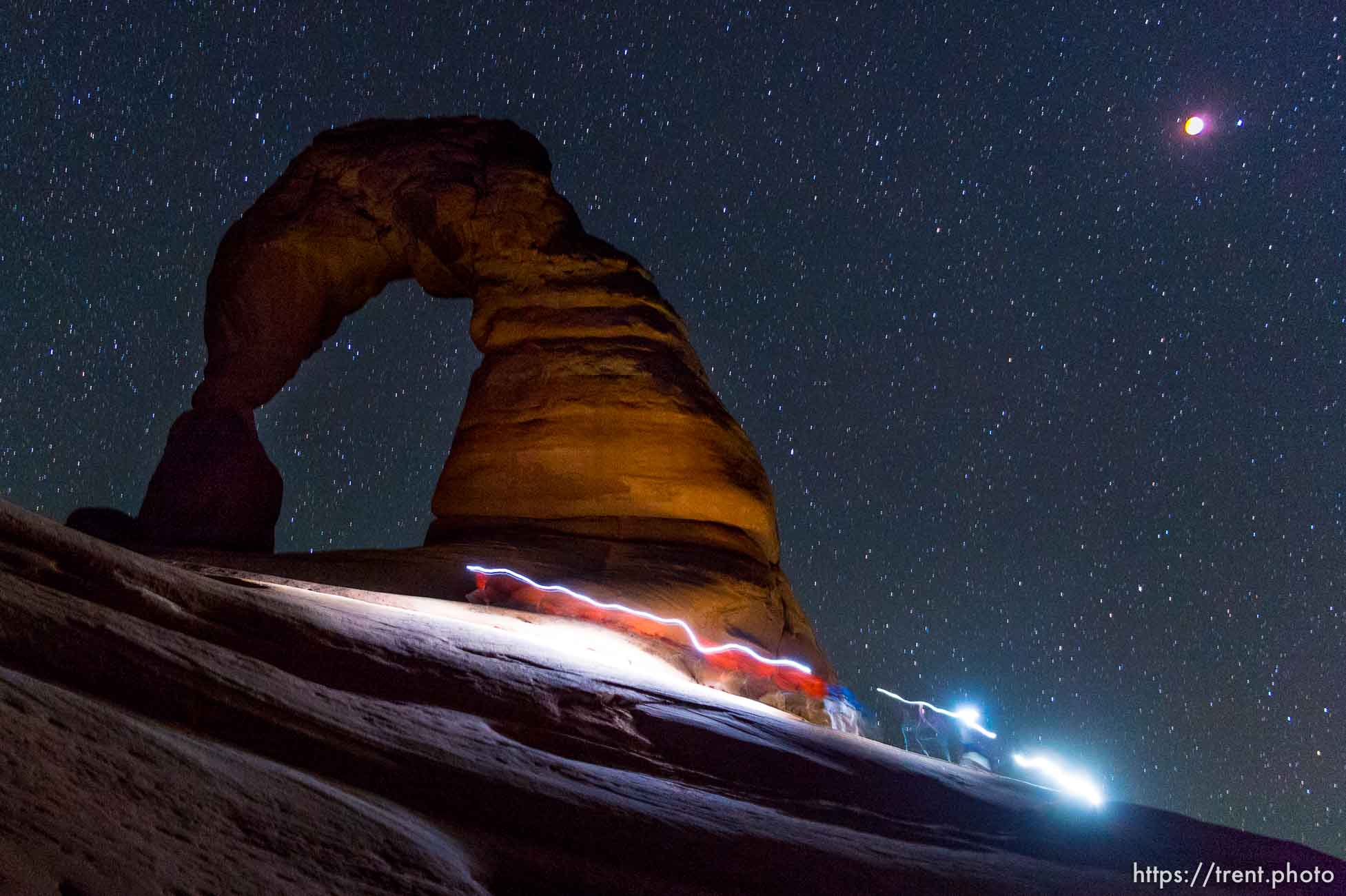 Trent Nelson  |  The Salt Lake Tribune
Onlookers of the total lunar eclipse at Delicate Arch in Arches National Park, Tuesday April 15, 2014.