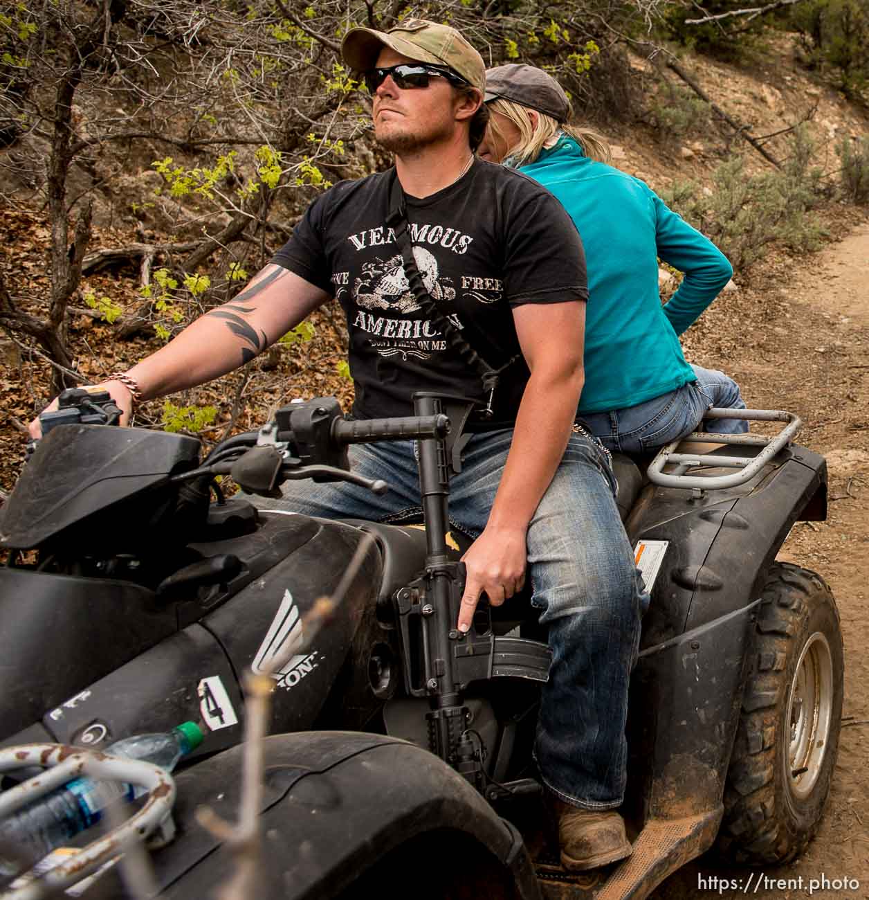 Trent Nelson  |  The Salt Lake Tribune
A rider holds his finger off the trigger of his assault rifle as motorized vehicles make their way through Recapture Canyon, which has been closed to motorized use since 2007, after a call to action by San Juan County Commissioner Phil Lyman. Saturday May 10, 2014 north of Blanding.