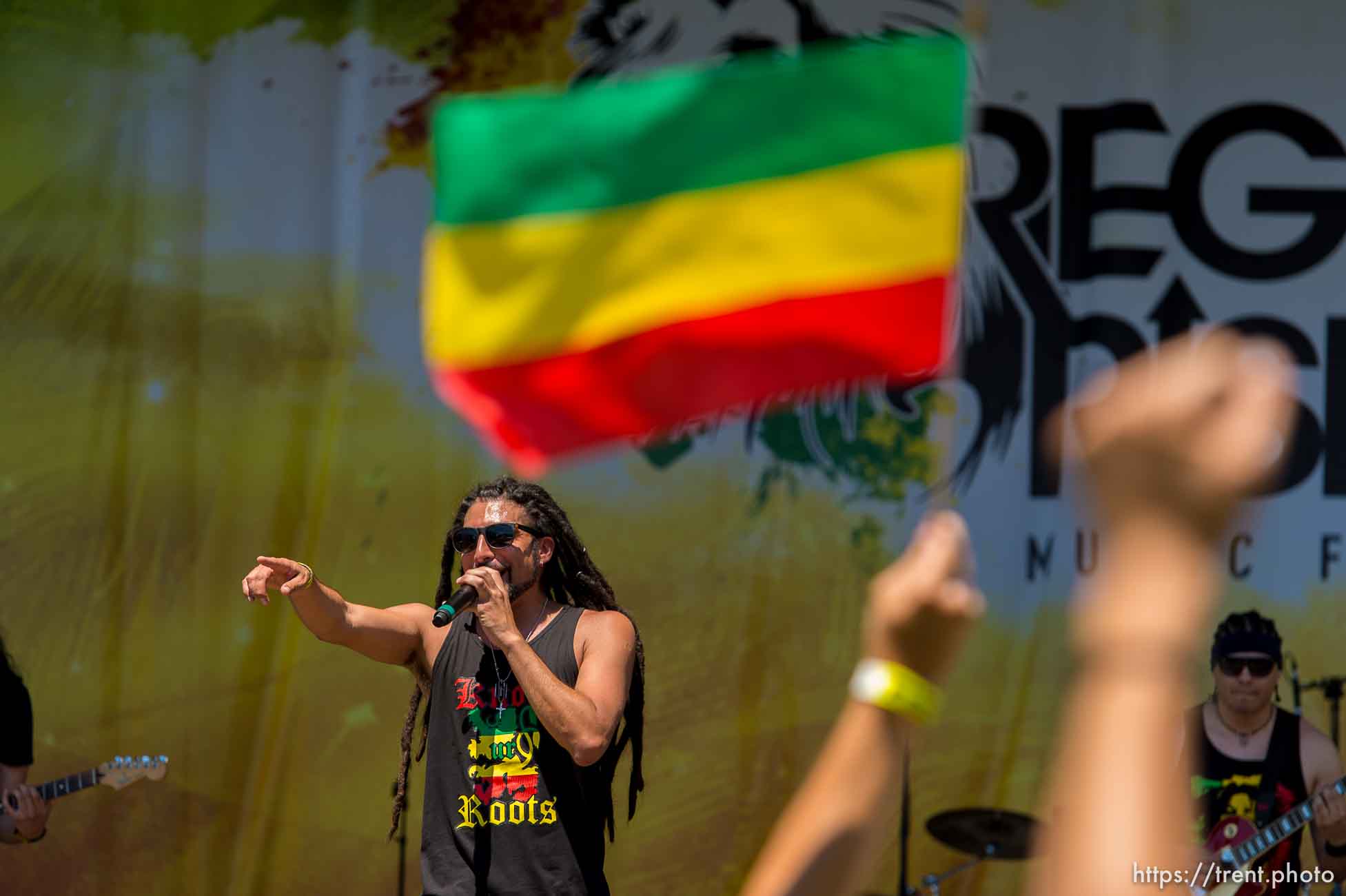 Trent Nelson  |  The Salt Lake Tribune
Antonio Elgueta, singing for Know UR Roots, at the Reggae Rise Up Festival in Liberty Park, Salt Lake City, Saturday July 12, 2014. The festival is in its fifth year and expects to draw close to 17,000 people over two days. Saturday night features Matisyahu and The Expandables. The festival continues Sunday with a lineup that includes Slightly Stoopid and Stephen Ragga Marley.