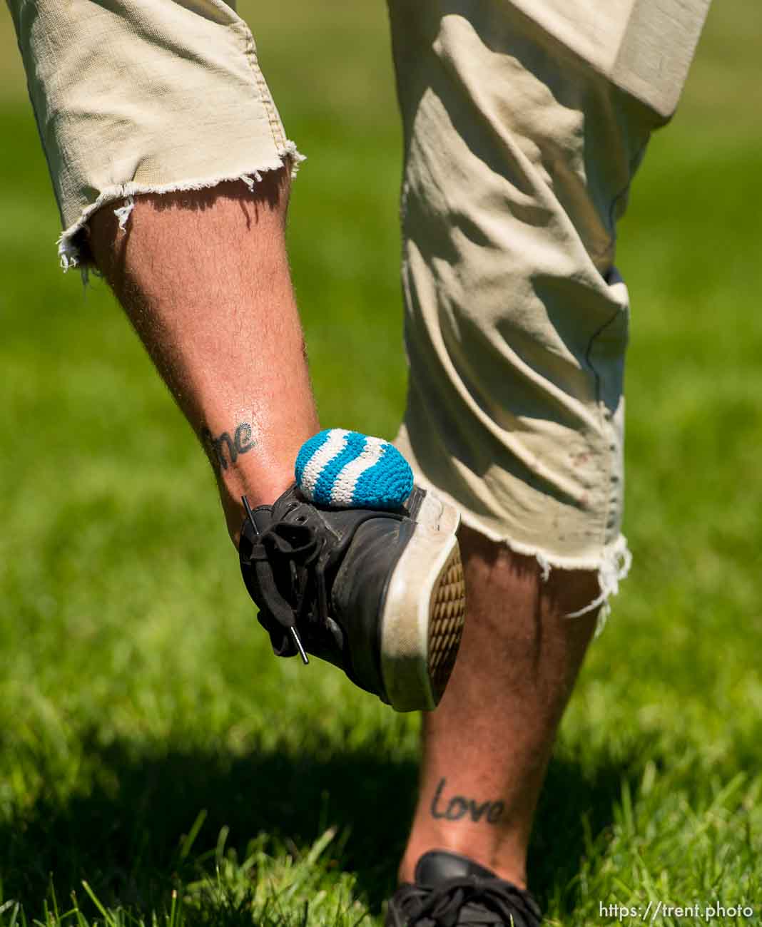 Trent Nelson  |  The Salt Lake Tribune
Reggae fans play hackey sack at the Reggae Rise Up Festival in Liberty Park, Salt Lake City, Saturday July 12, 2014. The festival is in its fifth year and expects to draw close to 17,000 people over two days. Saturday night features Matisyahu and The Expandables. The festival continues Sunday with a lineup that includes Slightly Stoopid and Stephen Ragga Marley.