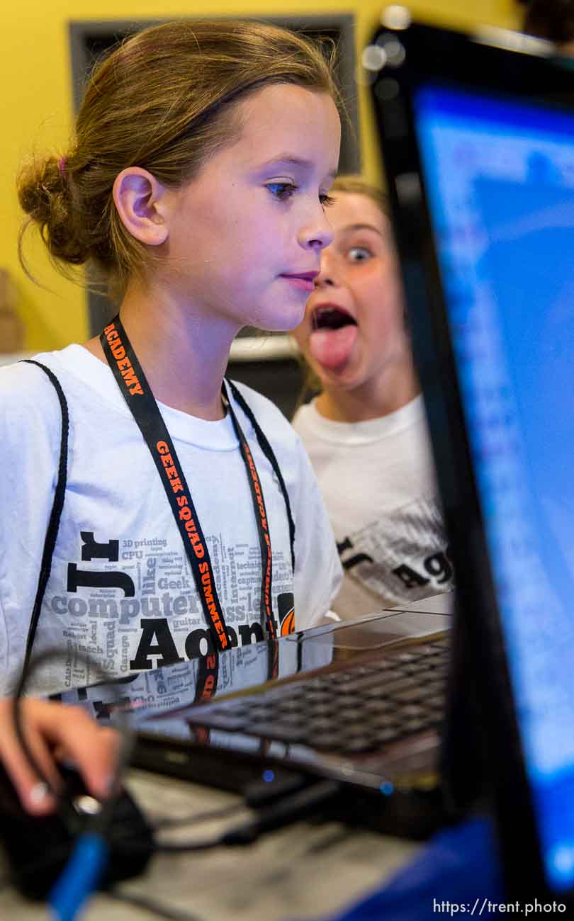 Trent Nelson  |  The Salt Lake Tribune
Sadie Badger gets photobombed while working in a 3D Printing class put on by Geek Squad Academy at the Discovery Gateway Children's Museum in Salt Lake City, Wednesday July 16, 2014. The two day camp puts kids through five different classes: 3D imaging, film and script, digital music, digital responsibility and robotics.