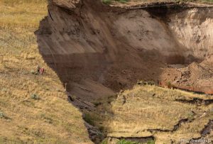 Trent Nelson  |  The Salt Lake Tribune
Workers inspecting a large mudslide in North Salt Lake that destroyed one home and caused the evacuation of dozens more, Tuesday August 5, 2014.