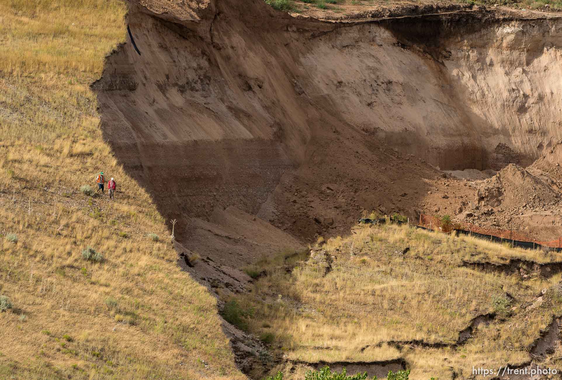 Trent Nelson  |  The Salt Lake Tribune
Workers inspecting a large mudslide in North Salt Lake that destroyed one home and caused the evacuation of dozens more, Tuesday August 5, 2014.