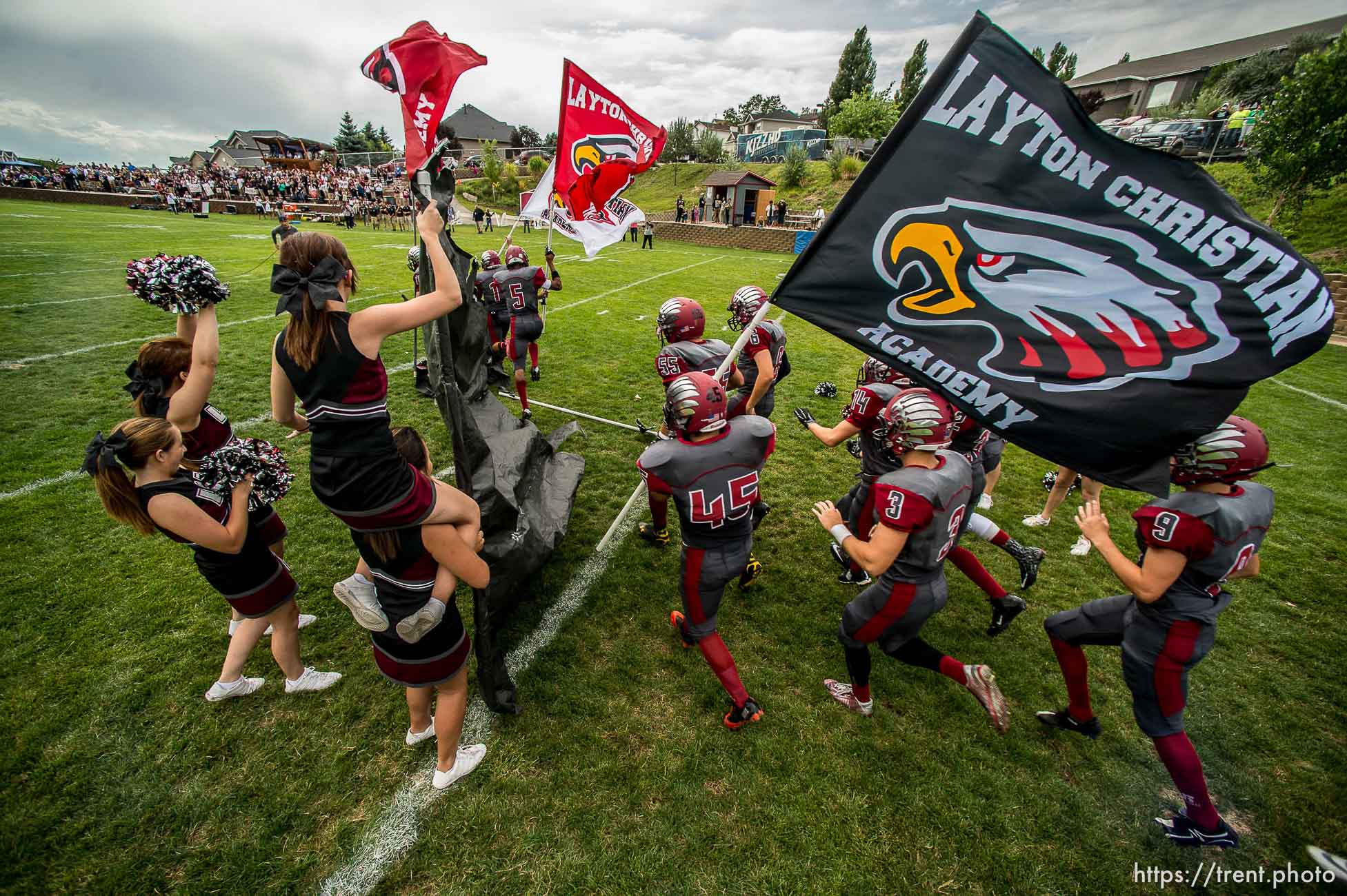 Trent Nelson  |  The Salt Lake Tribune
Layton Christian takes the field for their home opener, hosting Duchesne, high school football in Layton Thursday August 21, 2014.