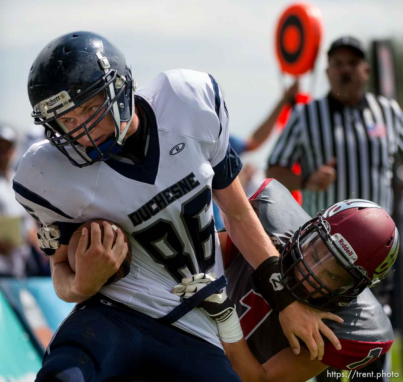 Trent Nelson  |  The Salt Lake Tribune
Duchesne's Wyatt Remund shrugs off Layton Christian's Rodrigo Santos en route to scoring the first touchdown of the Utah high school football season, in Layton Thursday August 21, 2014.