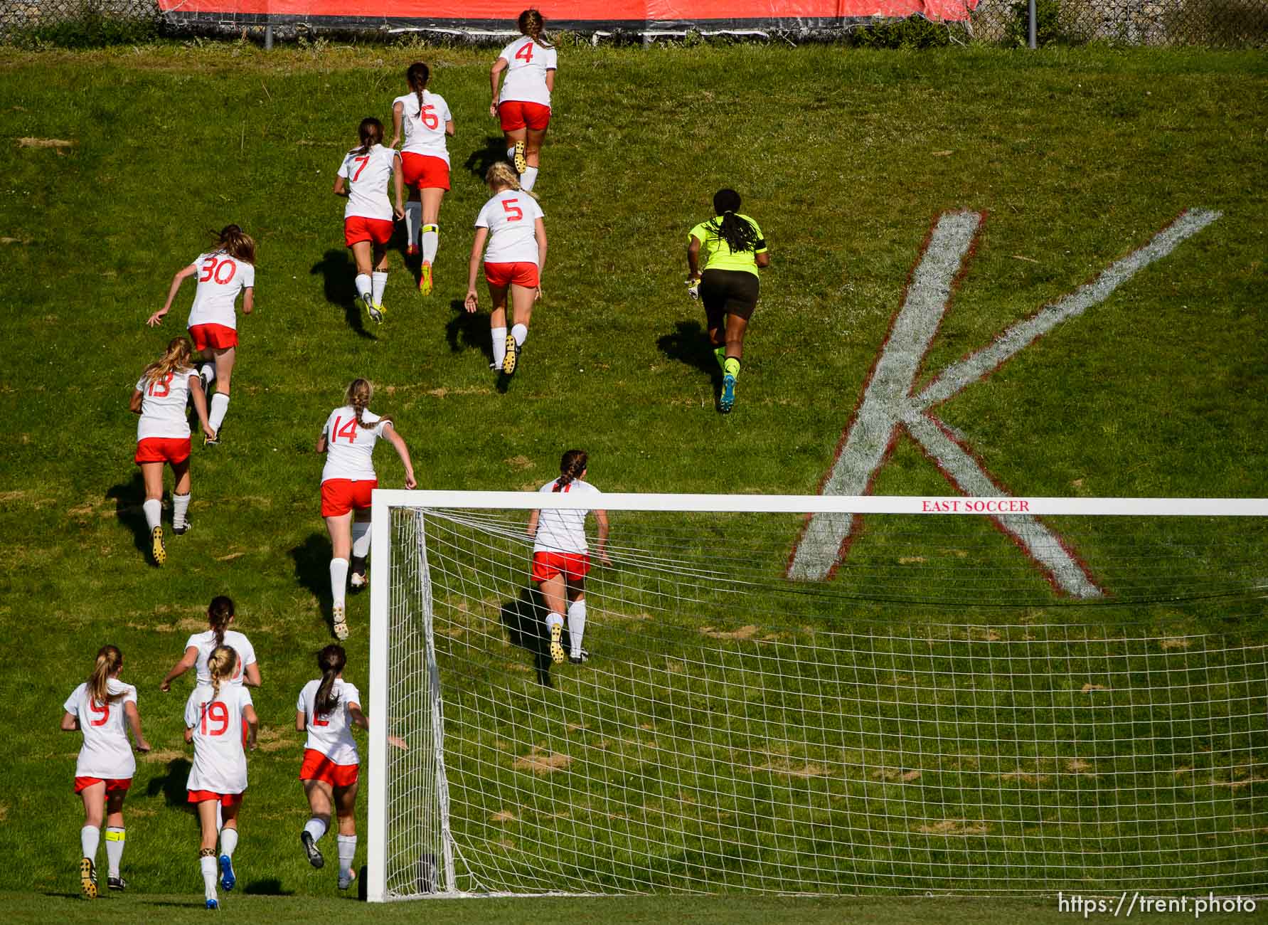 Trent Nelson  |  The Salt Lake Tribune
East girls soccer players celebrate a 3-0 win over Woods Cross High School with a run up Kernodle's Hill, Thursday September 4, 2014.