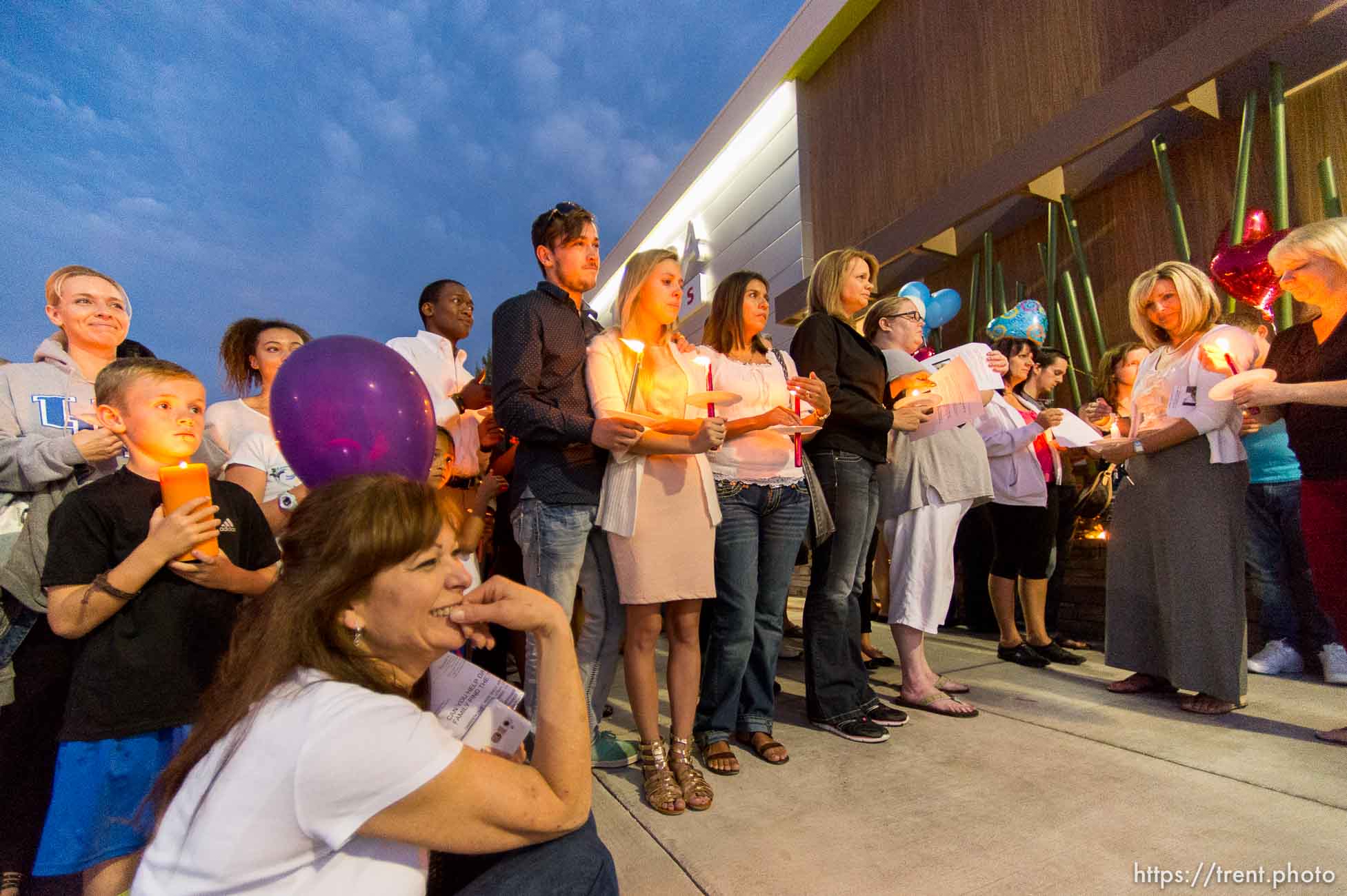 Trent Nelson  |  The Salt Lake Tribune
Susan Hunt, lower left, listens to stories about her son, Darrien Hunt, at a candlelight vigil Sunday September 14, 2014 for Darrien, who was shot and killed by Saratoga Springs police.