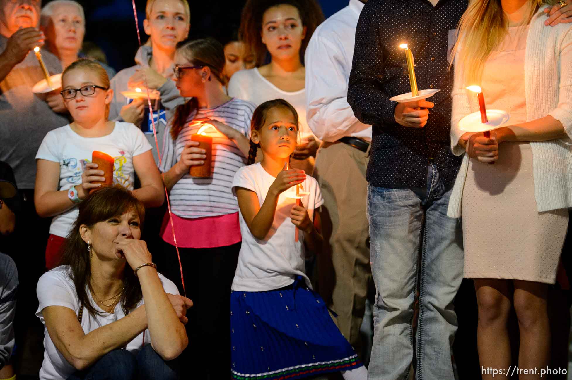 Trent Nelson  |  The Salt Lake Tribune
Susan Hunt, lower left, listens to stories about her son, Darrien Hunt, at a candlelight vigil Sunday September 14, 2014 for Darrien, who was shot and killed by Saratoga Springs police.