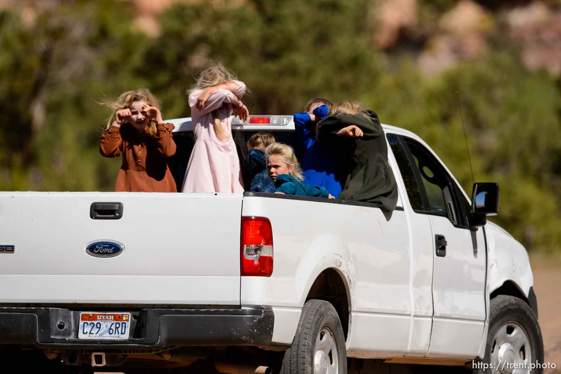 Trent Nelson  |  The Salt Lake Tribune
girls in back of truck in Hildale, Thursday September 25, 2014.