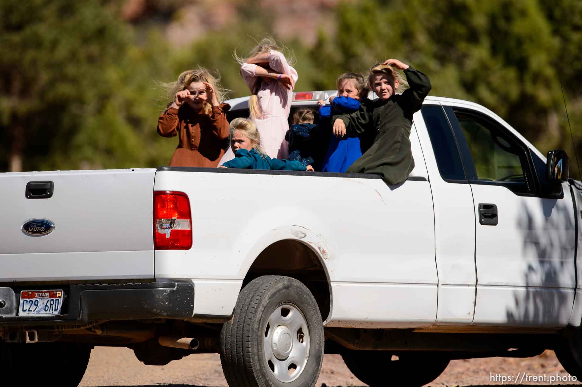 Trent Nelson  |  The Salt Lake Tribune
girls in back of truck in Hildale, Thursday September 25, 2014.