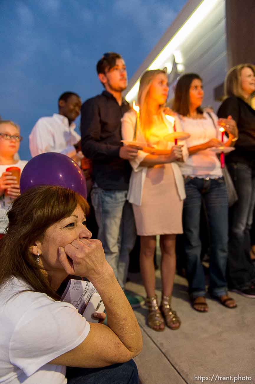 Trent Nelson  |  The Salt Lake Tribune
Susan Hunt, lower left, listens to stories about her son, Darrien Hunt, at a candlelight vigil Sunday September 14, 2014 for Darrien, who was shot and killed by Saratoga Springs police.