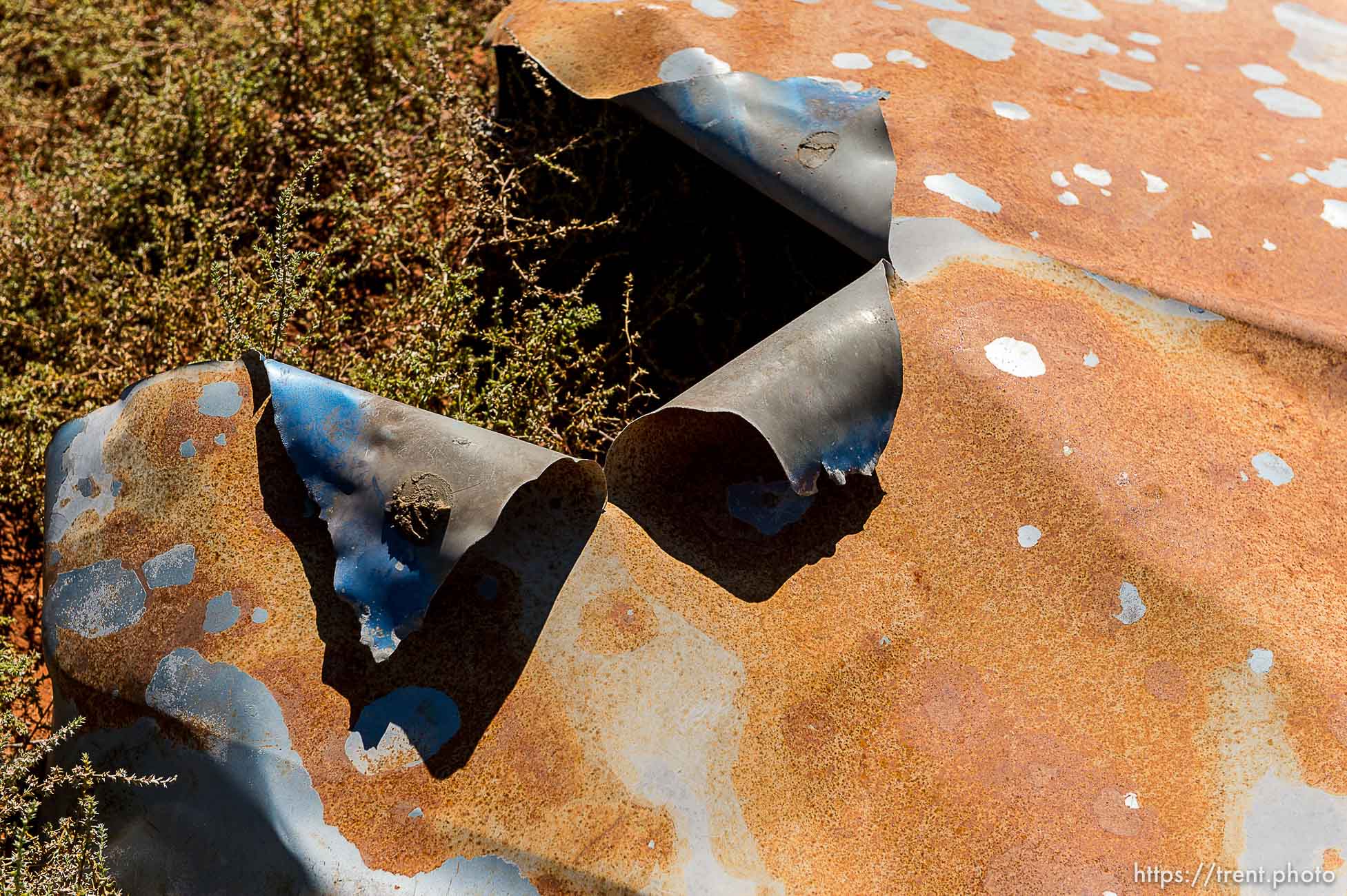 Trent Nelson  |  The Salt Lake Tribune
Andrew Chatwin points to the hood of a truck that was bombed, in Colorado City, Arizona, Thursday September 25, 2014.