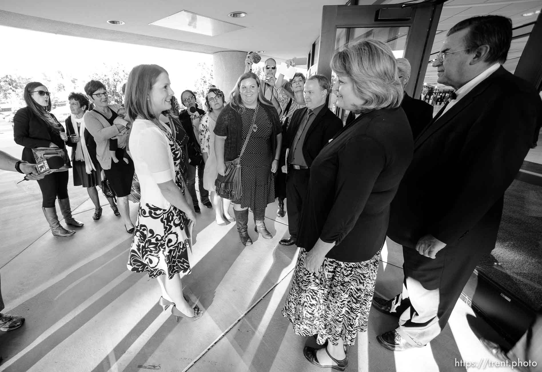 Trent Nelson  |  The Salt Lake Tribune
Abby Hansen, left, leads a group of women to the door of BYU's Marriott Center, where they are briefly stopped by volunteers Karen and Michael Roberts before being let in to watch a broadcast of the LDS General Priesthood Session, in Provo Saturday October 4, 2014.