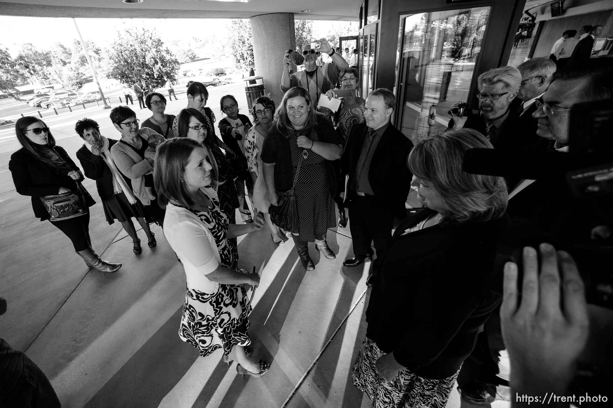 Trent Nelson  |  The Salt Lake Tribune
Abby Hansen, left, leads a group of women to the door of BYU's Marriott Center, where they are briefly stopped by volunteers Karen and Michael Roberts before being let in to watch a broadcast of the LDS General Priesthood Session, in Provo Saturday October 4, 2014.