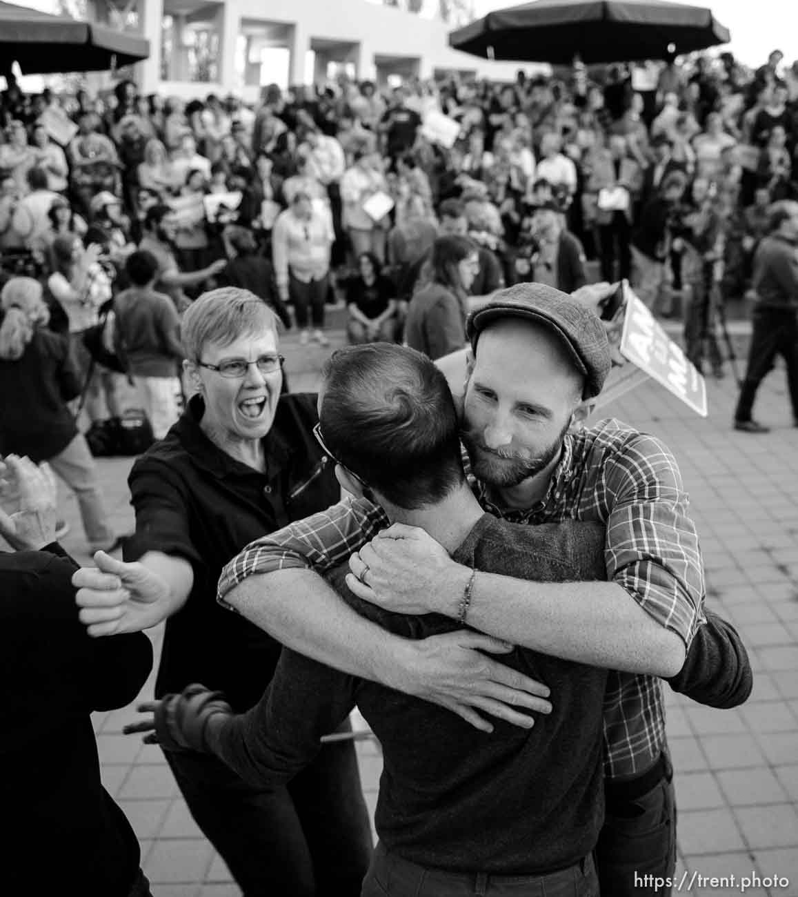 Trent Nelson  |  The Salt Lake Tribune
Debbie Johnson rushes in to embrace Kitchen v. Herbert plaintiffs Derek Kitchen and Moudi Sbeity at a rally to celebrate today's legalization of same-sex marriage, Monday October 6, 2014 in Salt Lake City.