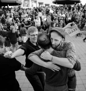 Trent Nelson  |  The Salt Lake Tribune
Debbie Johnson rushes in to embrace Kitchen v. Herbert plaintiffs Derek Kitchen and Moudi Sbeity at a rally to celebrate today's legalization of same-sex marriage, Monday October 6, 2014 in Salt Lake City.