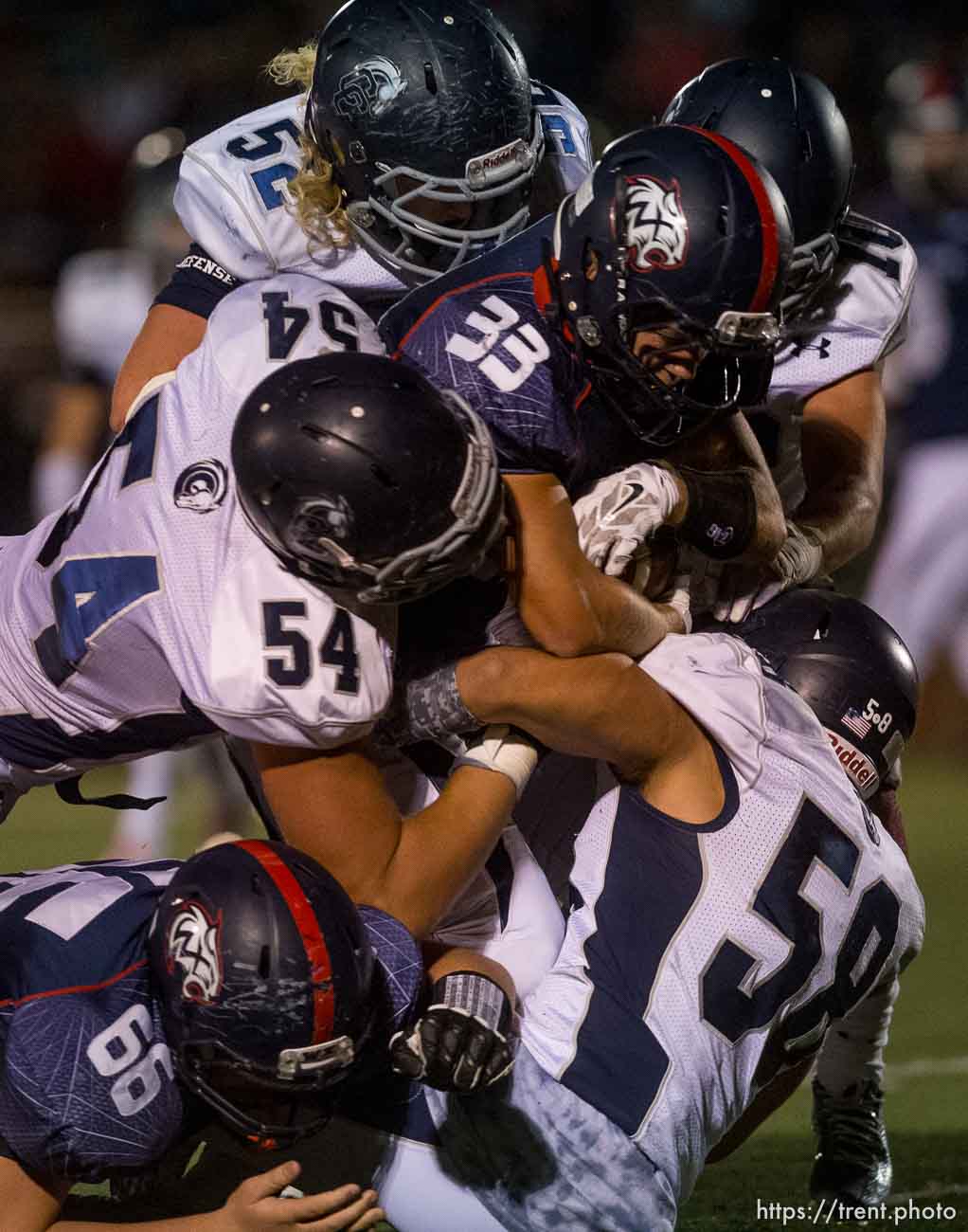 Trent Nelson  |  The Salt Lake Tribune
Corner Canyon defenders bring down Woods Cross's Jaret Davis as Woods Cross hosts Corner Canyon High School football, in Woods Cross, Wednesday October 15, 2014.