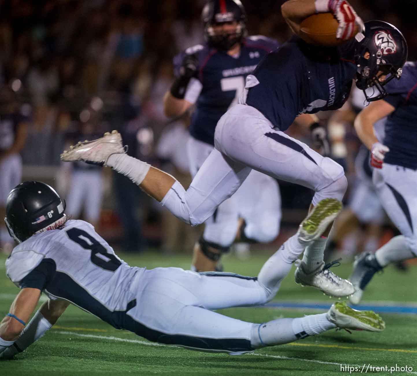 Trent Nelson  |  The Salt Lake Tribune
Woods Cross's Braxton Gunther leaps over Corner Canyon's Jake Cahoon as Woods Cross hosts Corner Canyon High School football, in Woods Cross, Wednesday October 15, 2014.